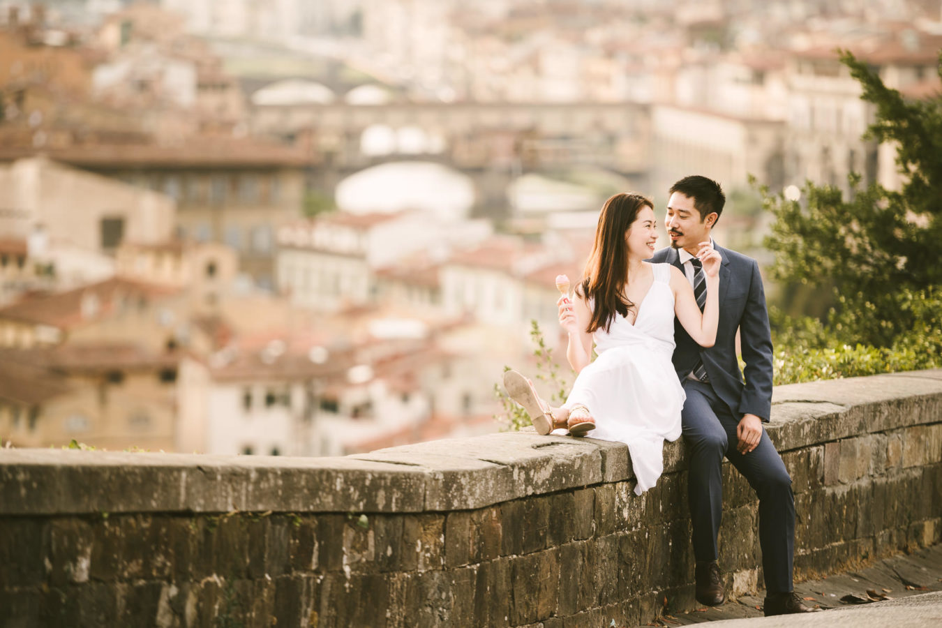 Romantic engagement photo in Florence, Tuscany with Old Bridge as background