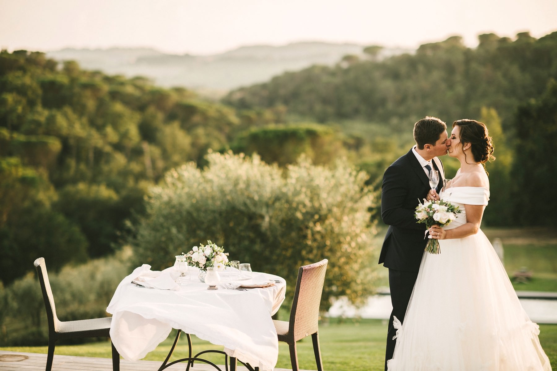 Dreamy couple portraits at the charming dinner setting. Elopement wedding in Tuscany countryside farmhouse Casetta
