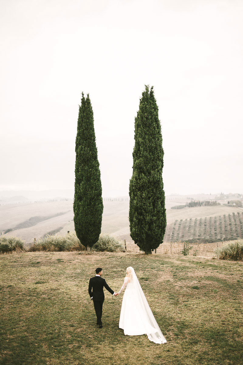 Elegant bride and groom portrait in Tuscany countryside Val D'Orcia at Podere Fornaci