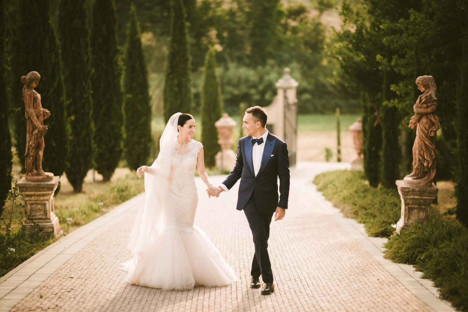Bride and groom portrait while walking at Tenuta Corbinaia in Tuscany countryside