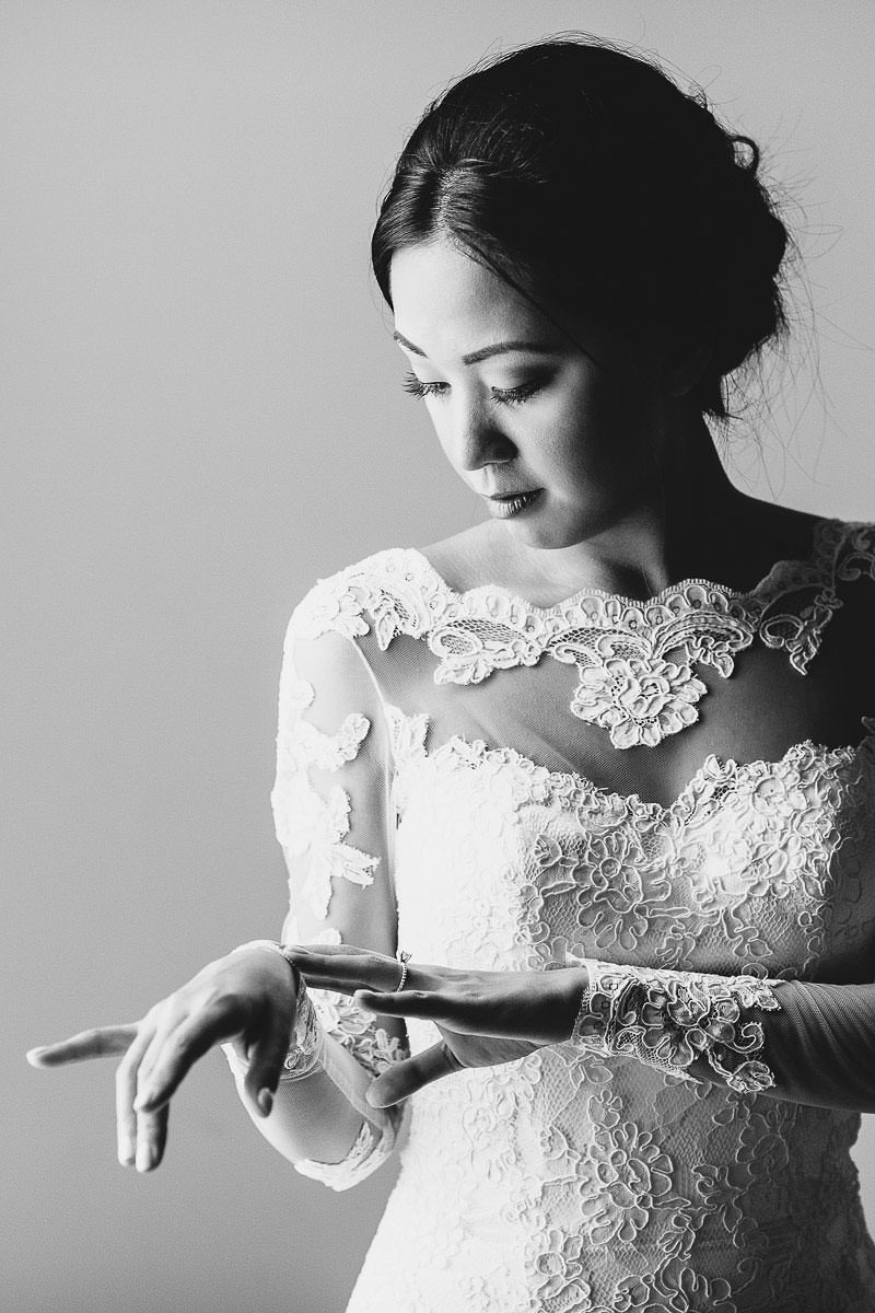 Elegant bride in dress by Augusta Jones elegant portrait just before to leave hotel for ceremony. Hotel Rosso in Florence Santa Maria Novella square. Castle destination wedding in Tuscany countryside at Vincigliata Castle