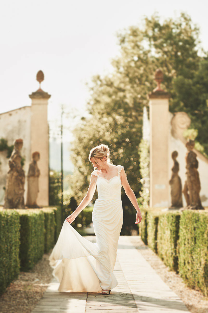 Lovely wedding bridal portrait in the Italian garden of Villa Le Piazzole near Florence into the countryside