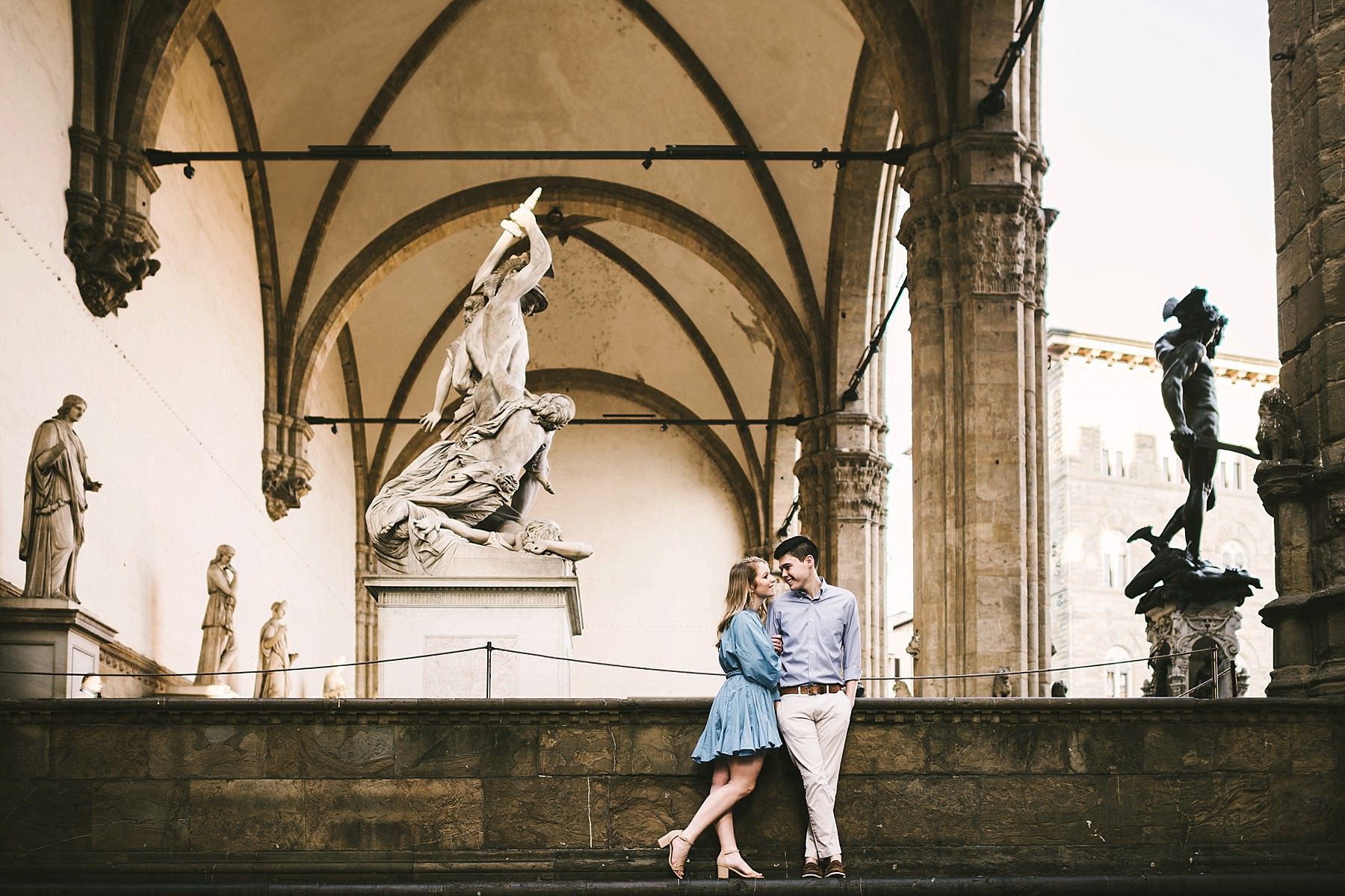 Never too young for romantic vacation photos in Florence. Early morning sunrise engagement photo shoot Piazza della Signoria