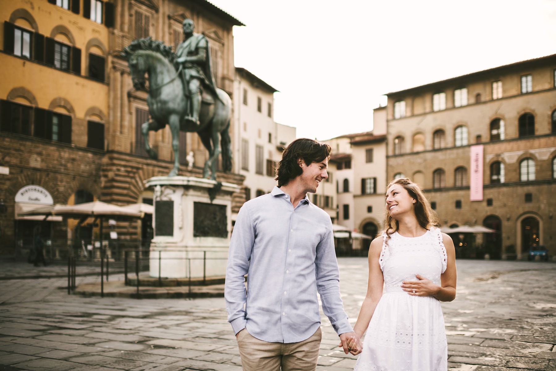 Lovely couple engagement photo shoot at sunrise time in Florence. Romantic couple portrait vacation photo session.
