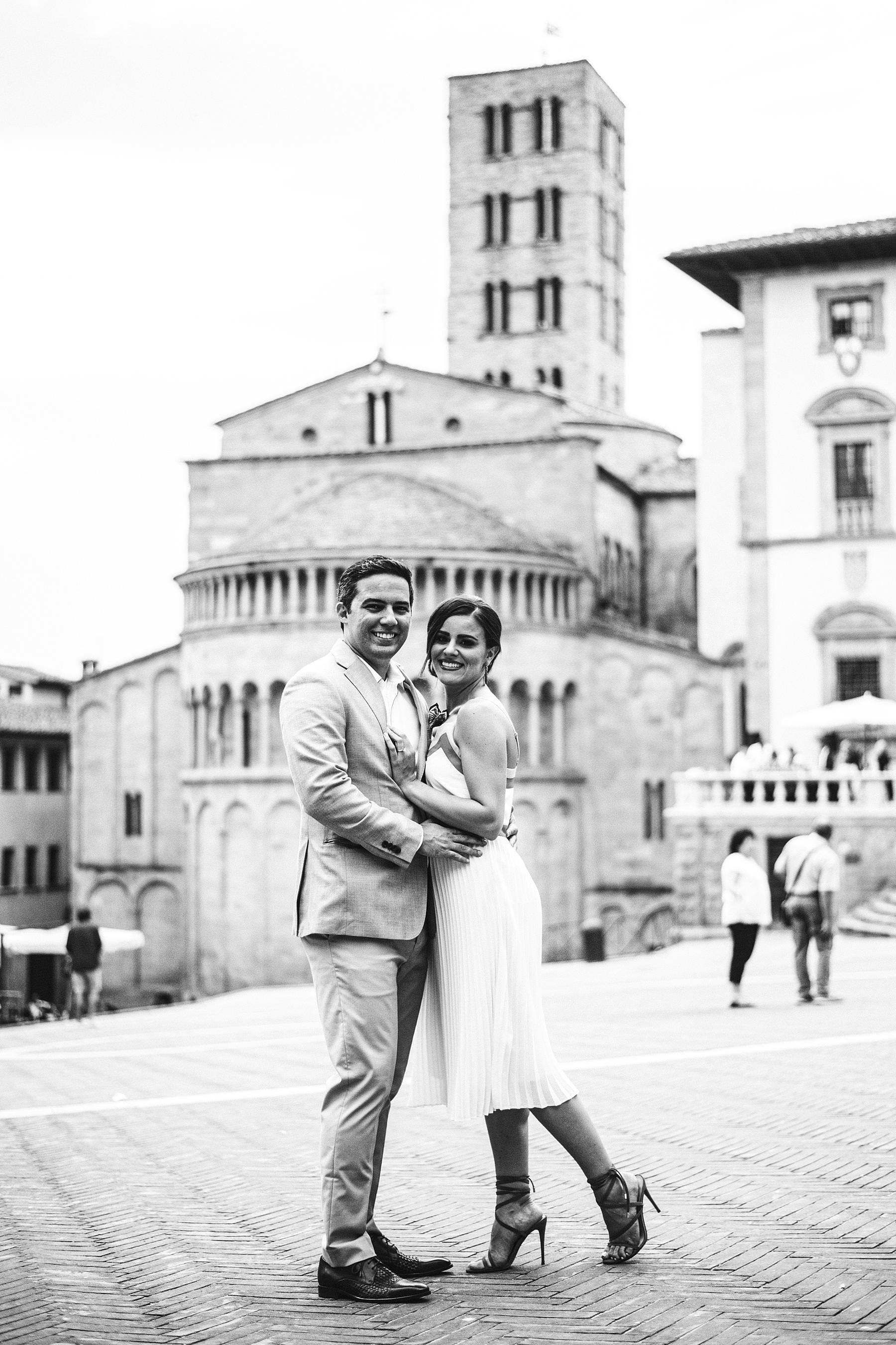 Destination wedding in Arezzo. Bride and groom prewedding couple portrait photo shoot at Piazza Grande during welcome dinner