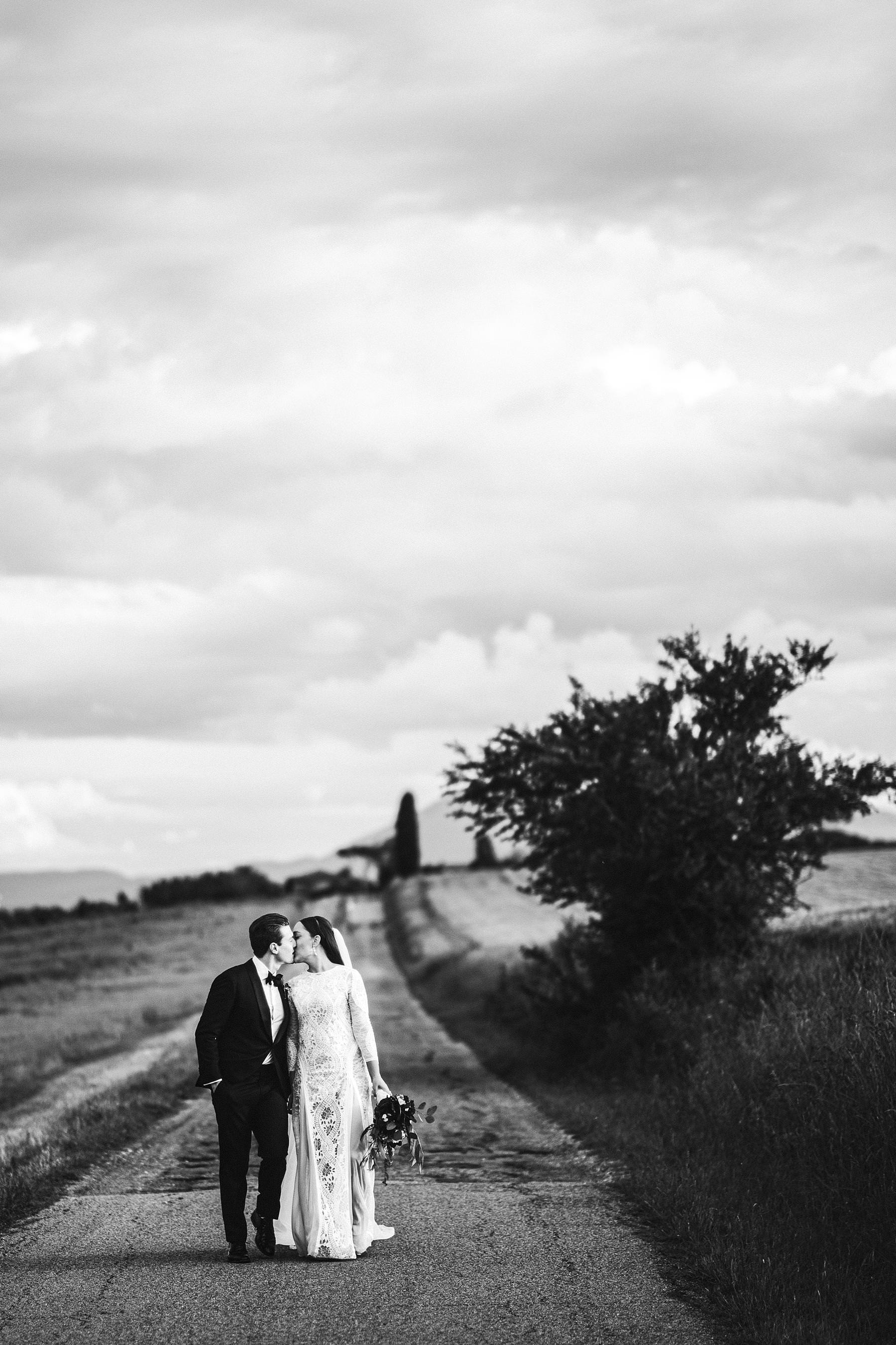 Romantic and timeless bride and groom wedding photo in Umbria near Villa l’Antica Posta venue. Bride dress by Grace Loves Lace