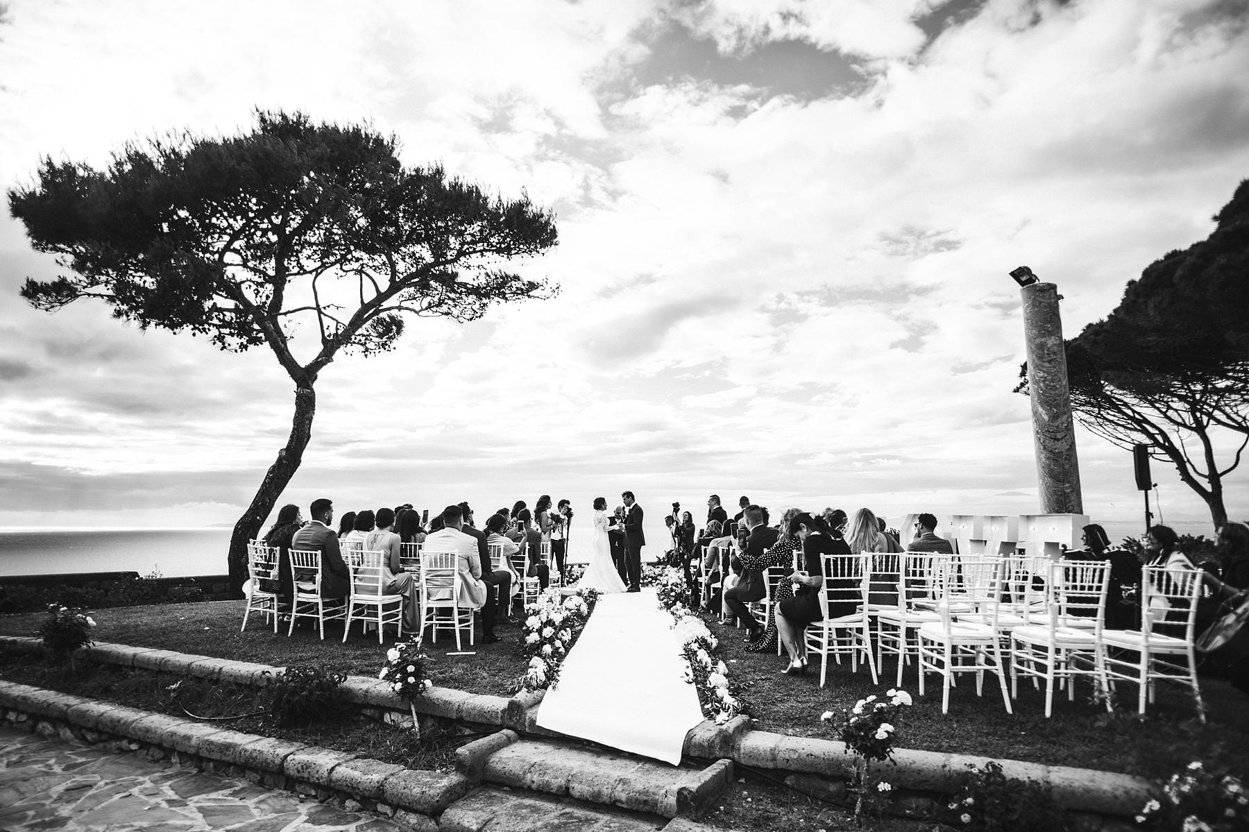 Dreamy outdoor emotional and elegant destination wedding ceremony in Sorrento at Villa Angelina terrace