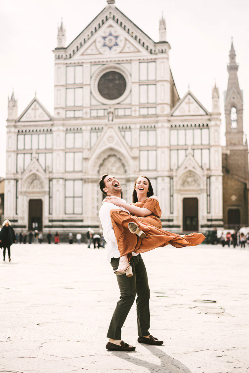 Lovely couple portrait at Santa Croce square in the heart of Florence at sunrise time