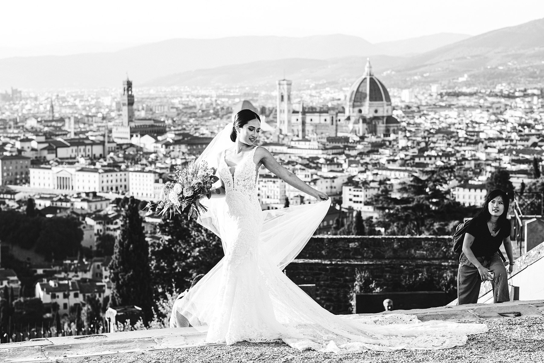 Lovely bride in her luxury Martina Liana wedding dress at the most breathtaking panoramic spot of Florence near Piazzale Michelangelo. Intimate destination wedding in Florence with reception at Belmond Villa San Michele