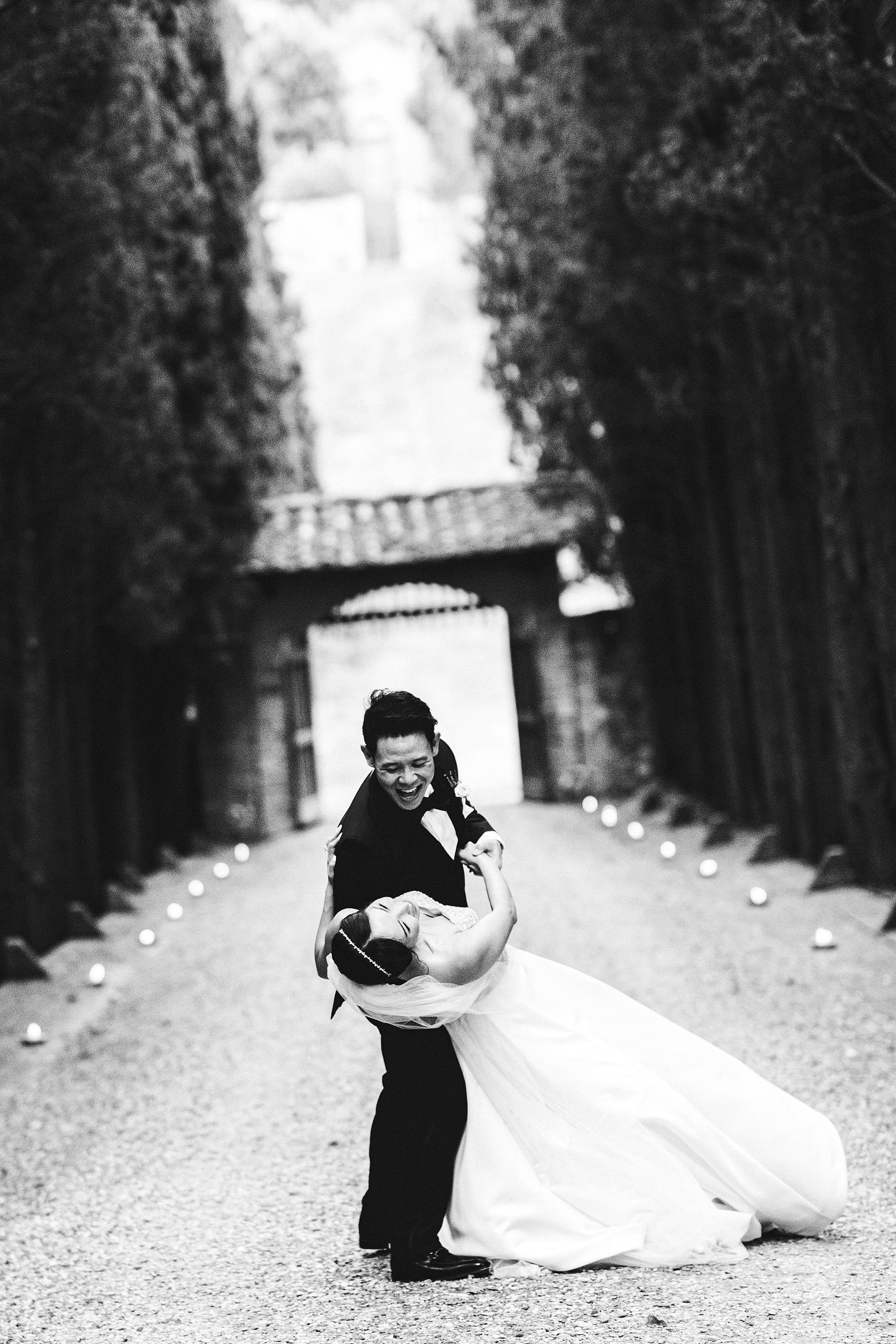Lovely bride and groom wedding photo at Castello Il Palagio venue in the countryside of Tuscany near Chianti. Intimate castle wedding in Italy
