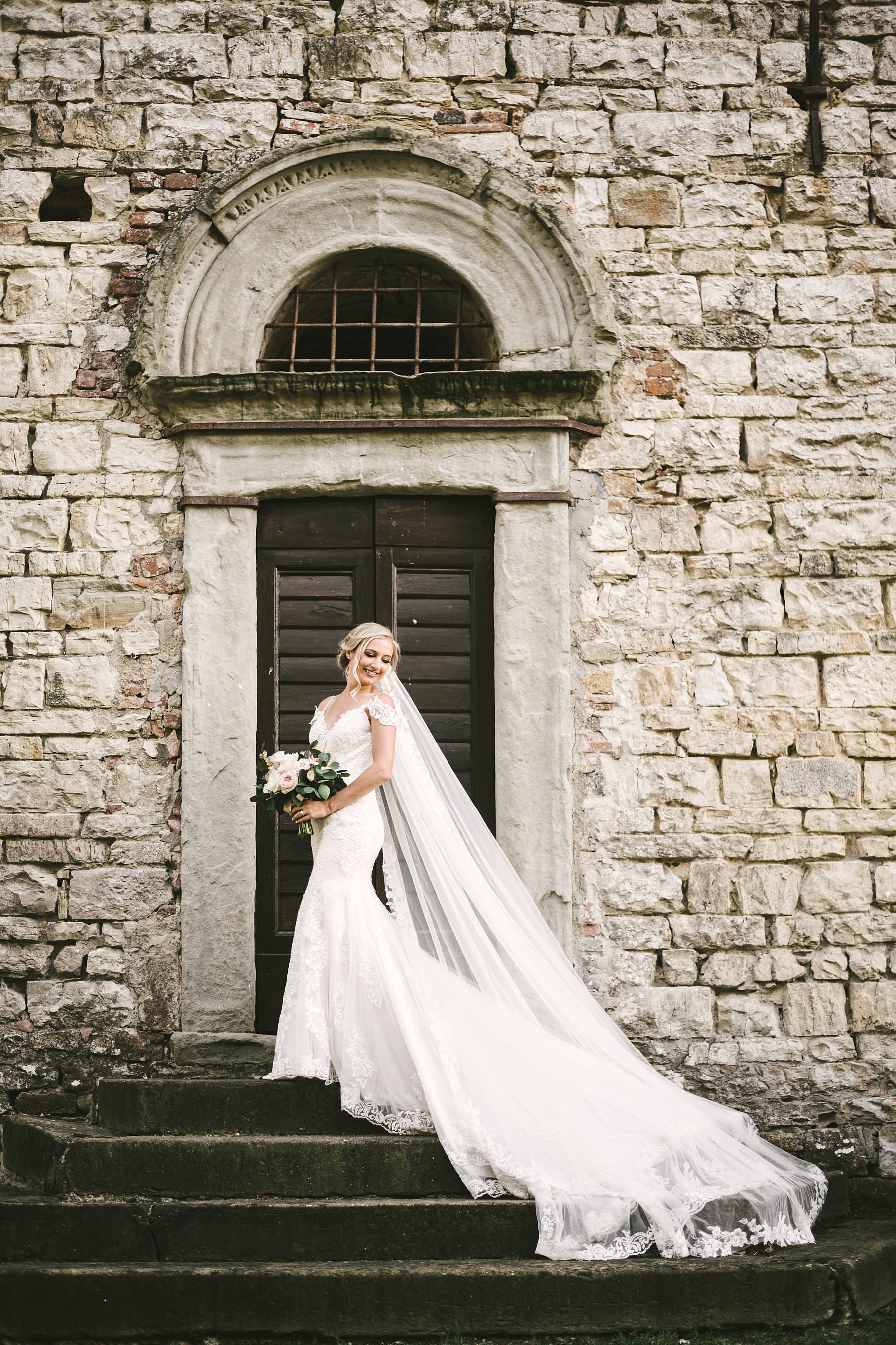 Romantic wedding in Italy at the charming Castello del Trebbio. Gorgeous bride Andorra wedding portrait at Castello del Trebbio in the countryside of Tuscany near Florence
