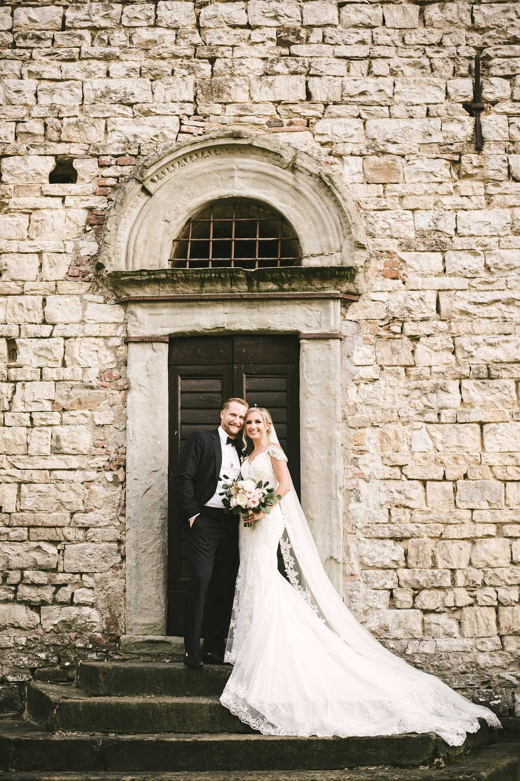 Romantic wedding in Italy at the charming Castello del Trebbio. Gorgeous bride and groom wedding portrait at Castello del Trebbio in the countryside of Tuscany near Florence