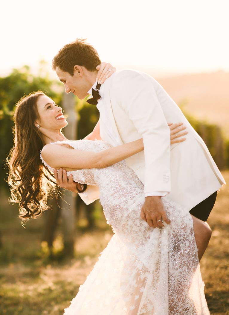 Unforgettable bride and groom portrait in a Tuscan vineyard near Panzano for destination wedding agriturismo near Panzano in Chianti