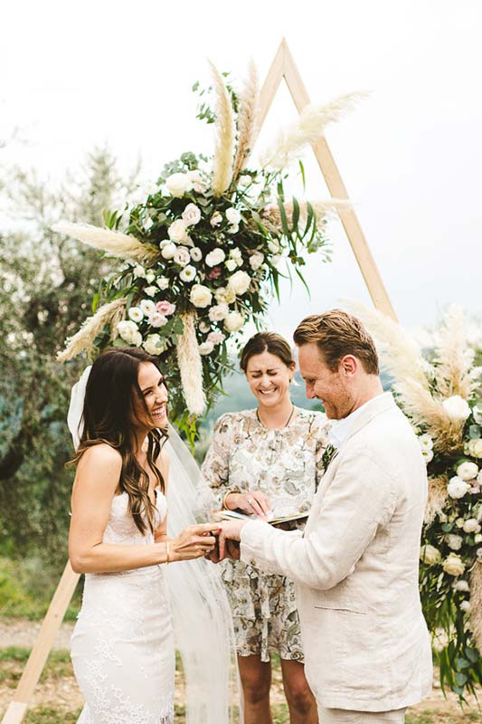 Modern and unusual wedding framed by the olive groves of Chianti. Intimate romantic and elegant destination wedding in Tuscany at historic residence of Villa Il Poggiale
