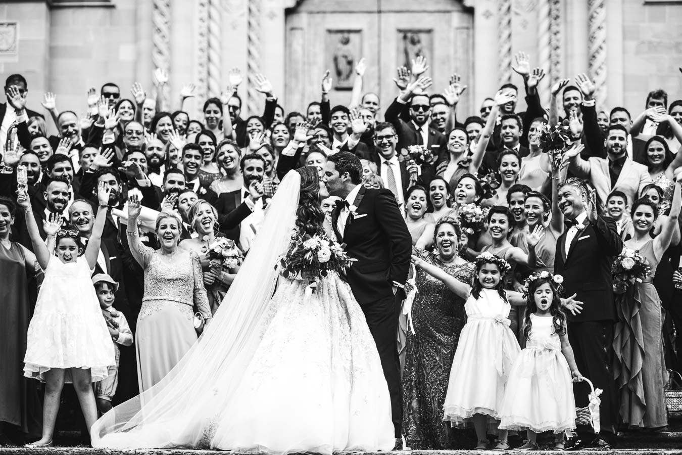 Rippling and sumptuous Tuscany wedding in the elegant Castle of Valenzano. Timeless and charm elegant bride and groom group photo at Arezzo Cathedral