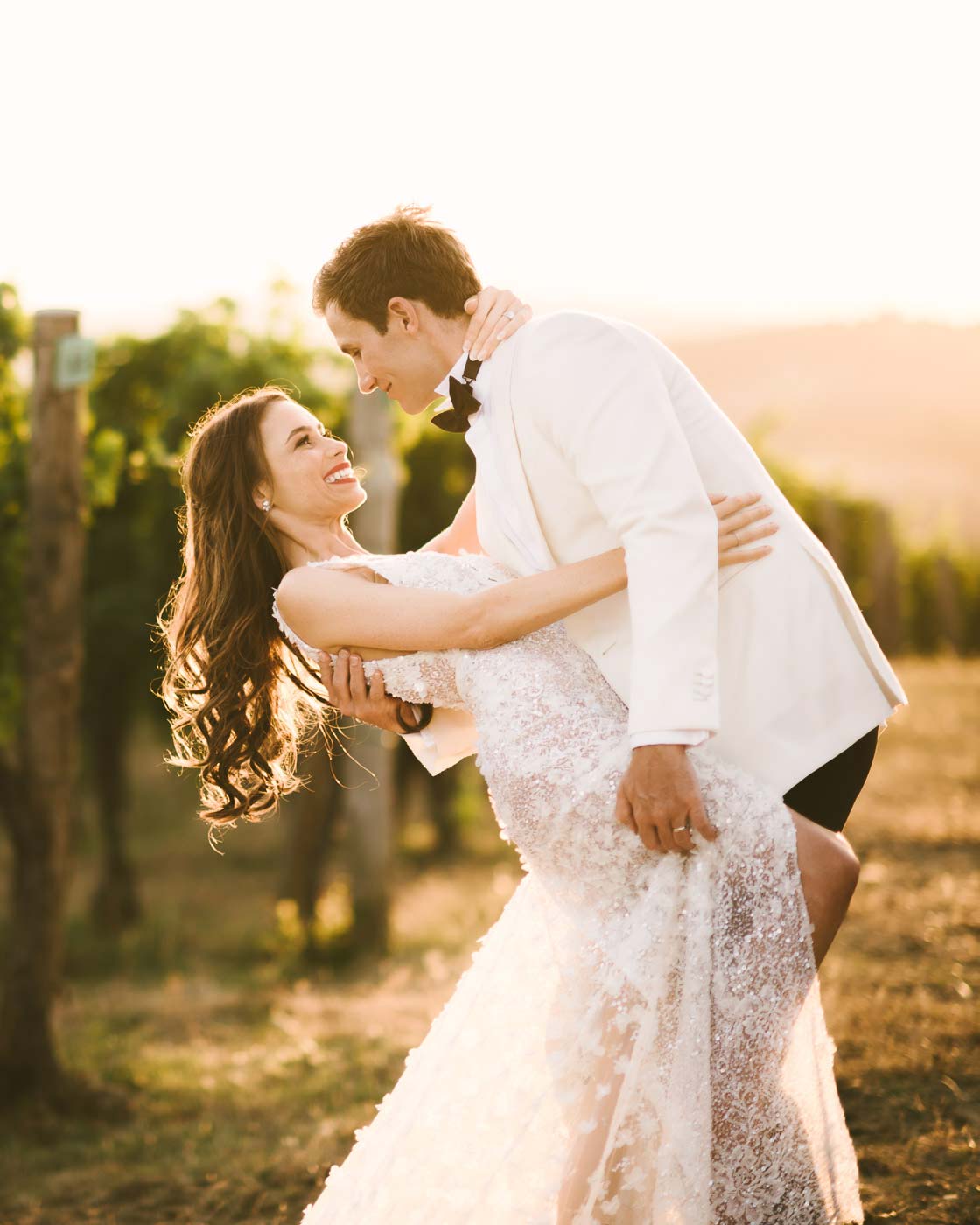 Unforgettable bride and groom portrait in a Tuscan vineyard near Panzano for destination wedding agriturismo near Panzano in Chianti