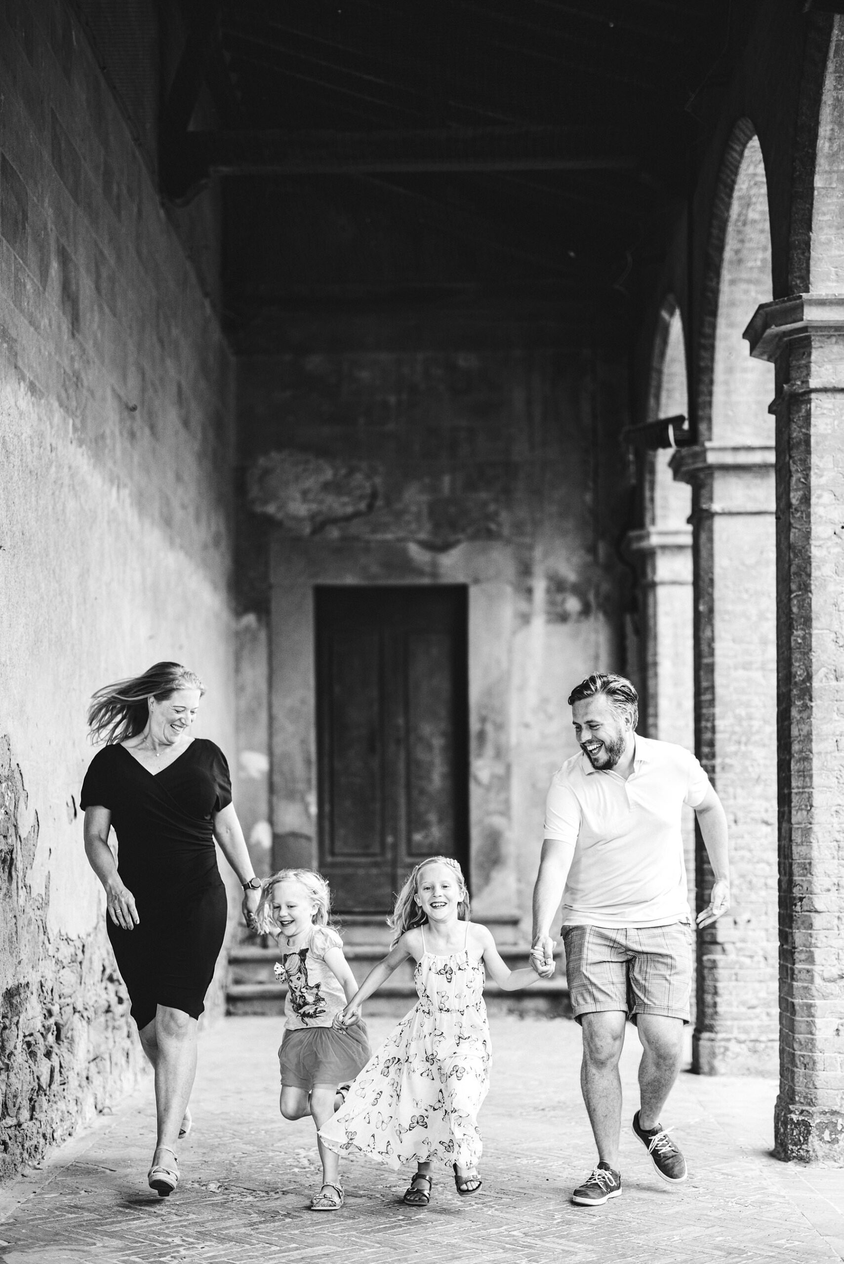 Exciting and funny family photo session in Tuscany typical borgo of Peccioli