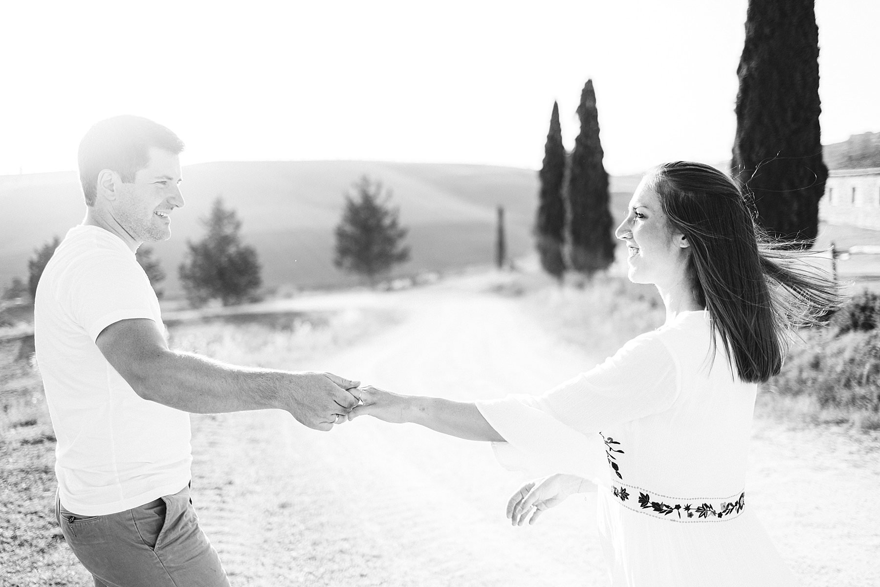 Best setting for couple photo shoot surely is the Val d’Orcia in Tuscany with its rolling hills and the evocative cypresses white roads
