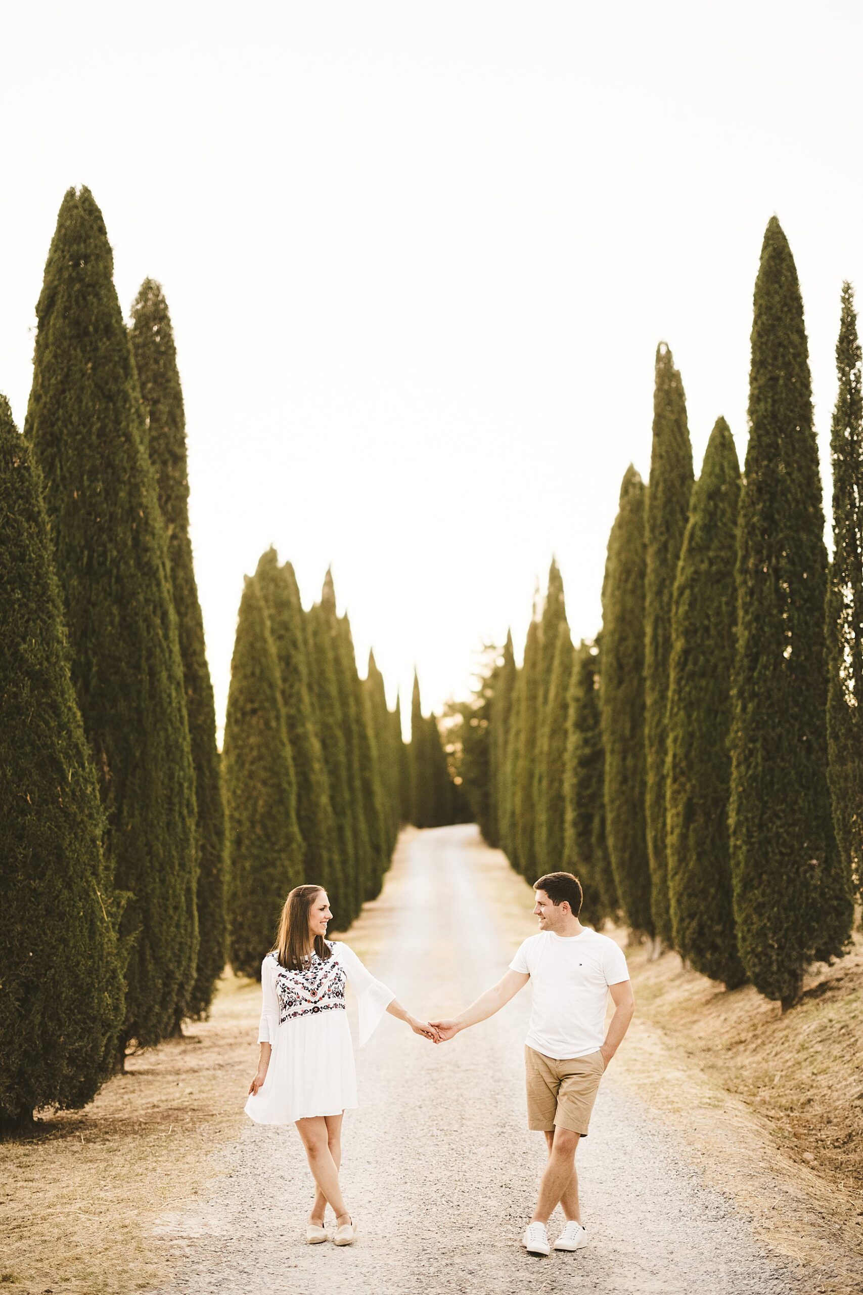 Anke and Marco’s romantic couple photoshoot in the evocative and typical avenues of cypresses near Pienza in the Val D’Orcia countryside of Tuscany