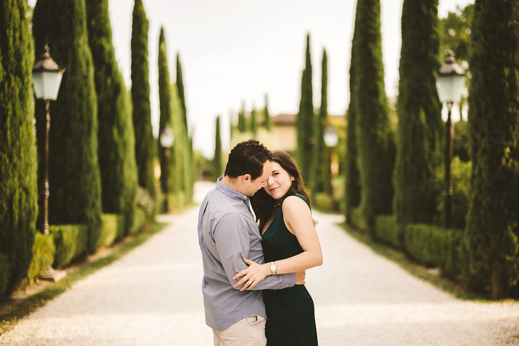 Romantic pre-wedding engagement session in Tuscany countryside in the splendid rural luxury destination of Borgo Santo Pietro which feature an evocative cypresses avenue, the very gem of the location