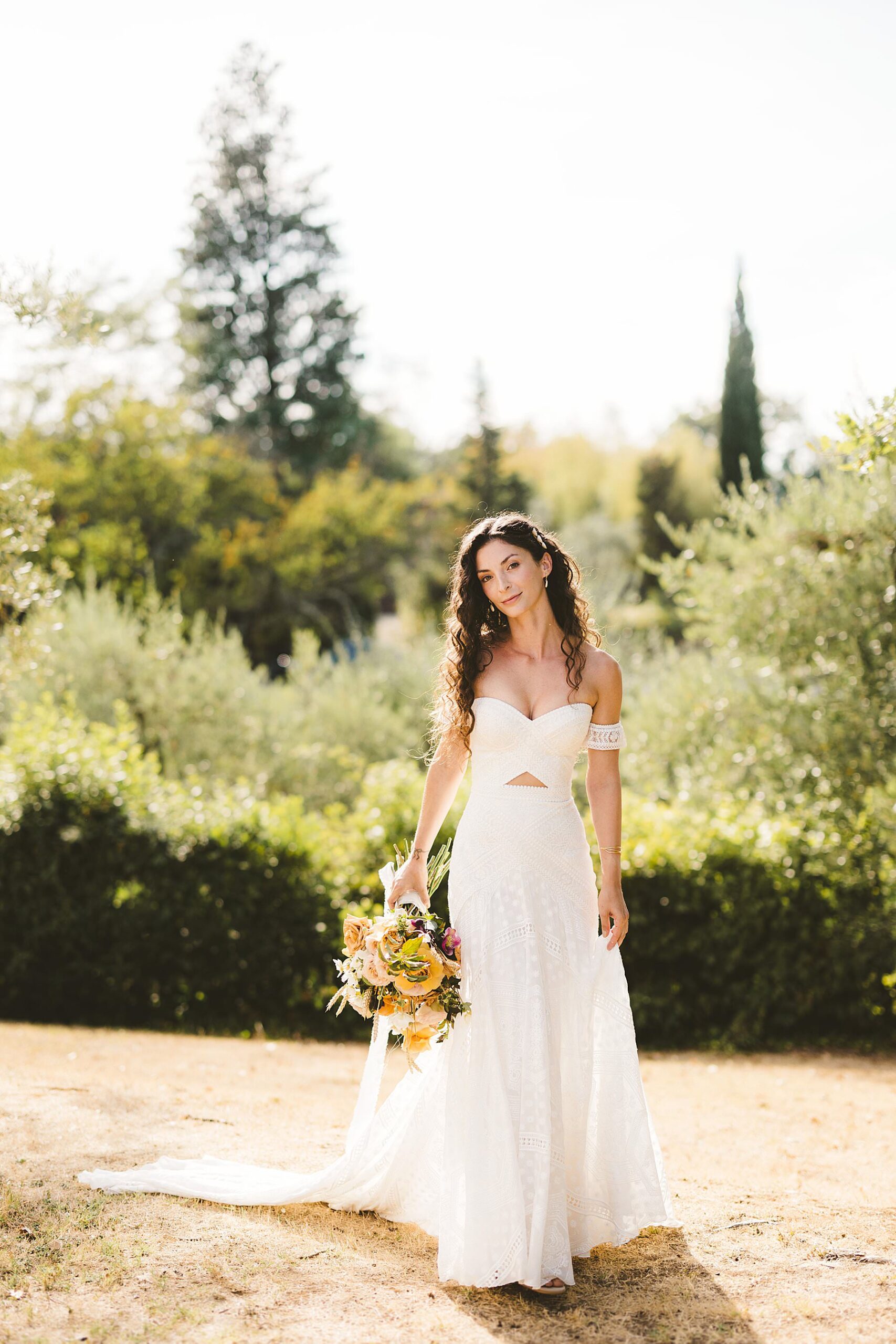Sweet and elegant bride portrait just before to walk the aisle for the intimate wedding ceremony at La Valle farmhouse in Montaione