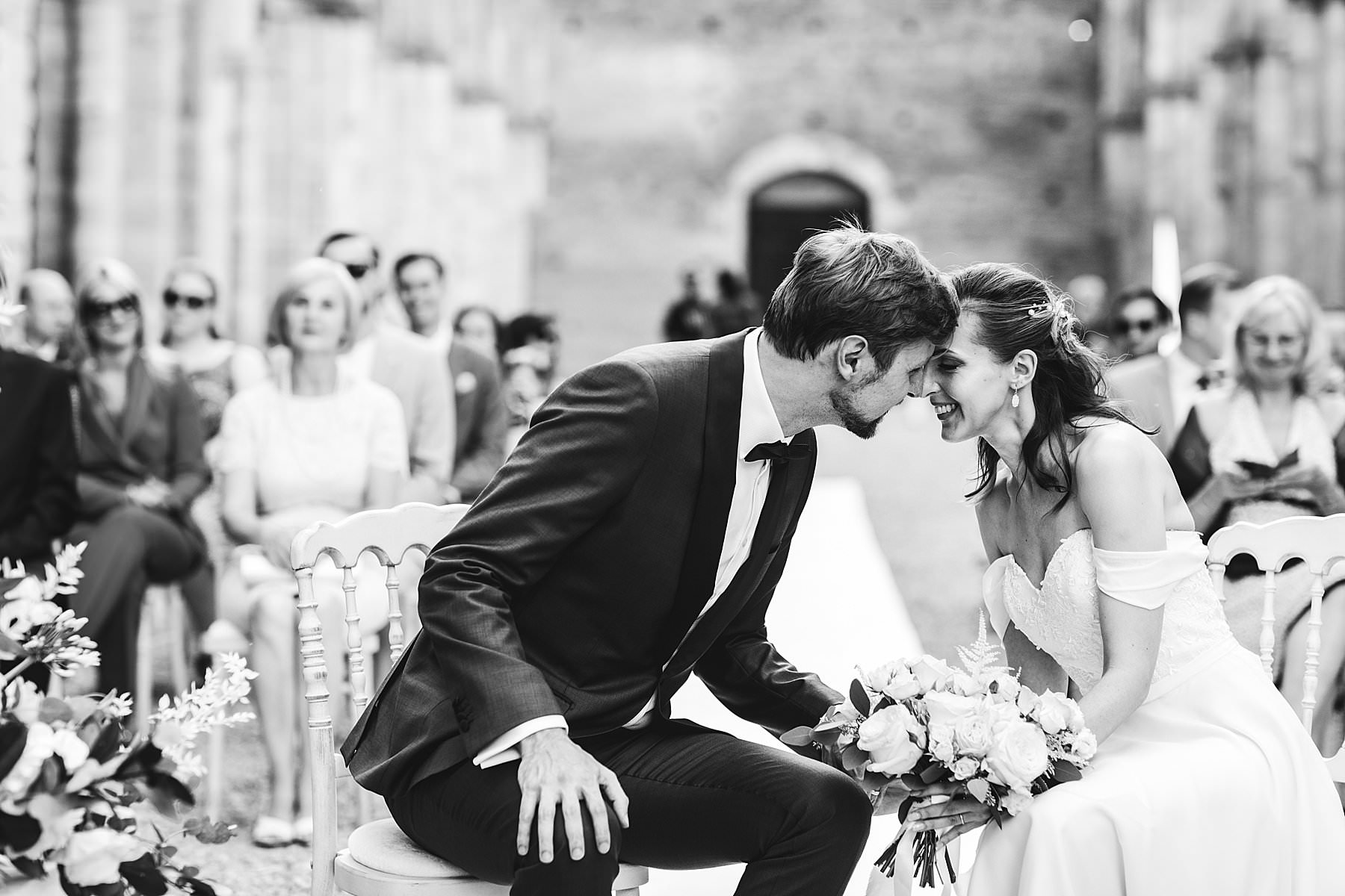 Lovely moment during intimate wedding at San Galgano Abbey in the heart of Tuscany near Siena