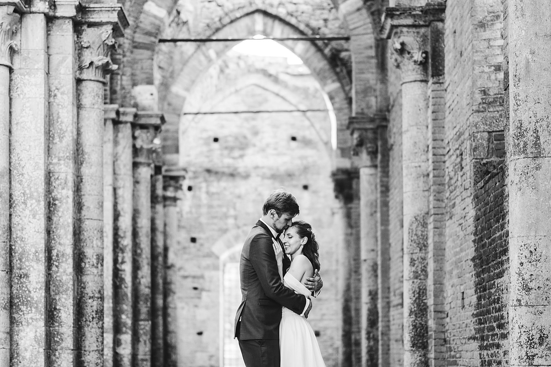 Fairytale bride and groom wedding photo at Roofless Abbey of San Galgano near Siena