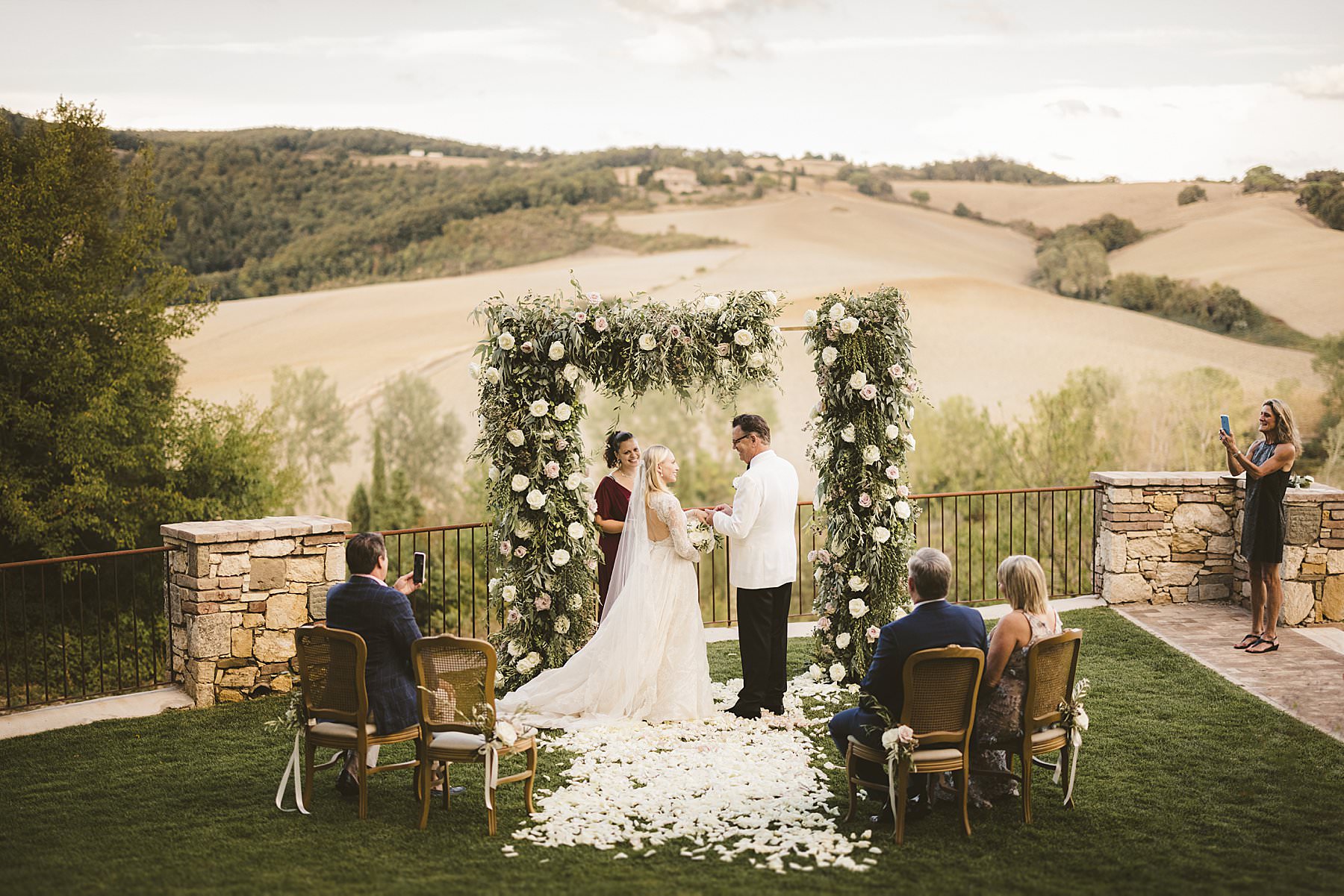 Very private elopement ceremony with breathtaking view of countryside of Tuscany at Borgo Pignano