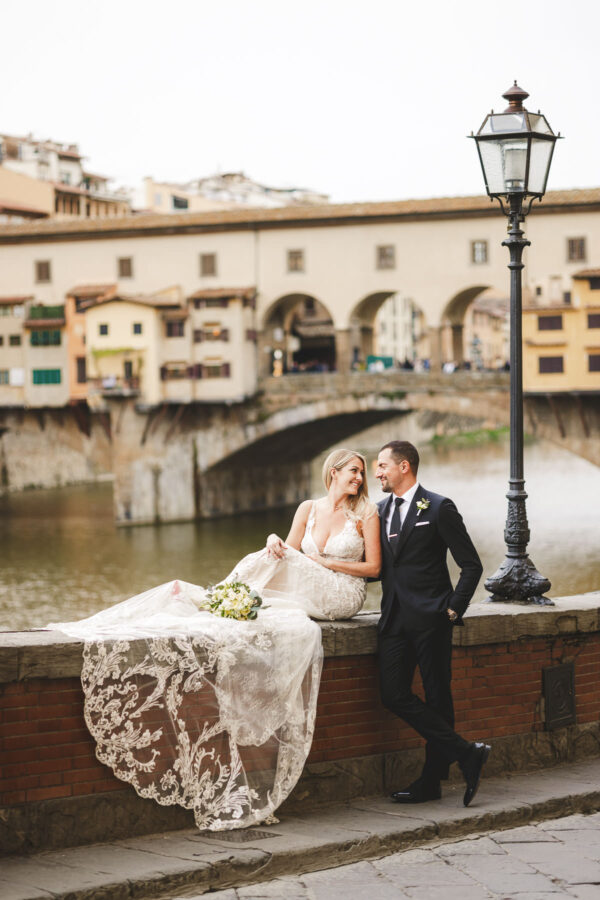 Elegant bride and groom elopement wedding photo in Florence by the the iconic Ponte Vecchio