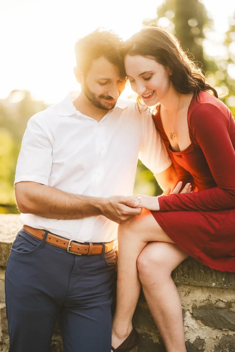 Lovely and candid moment during marriage proposal photo session in Florence during golden hour