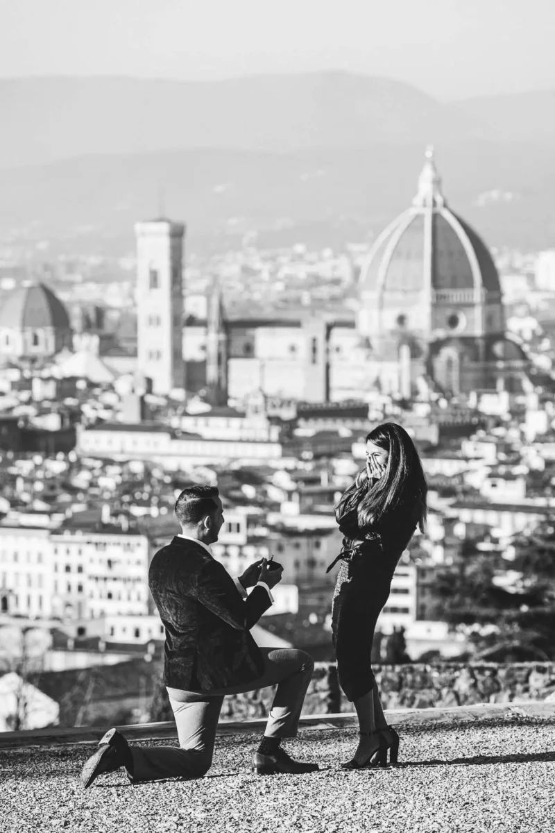 Lovely and unforgettable real surprise proposal photo session in Florence at San Miniato al Monte near Piazzale Michelangelo with breathtaking view of Florence as background