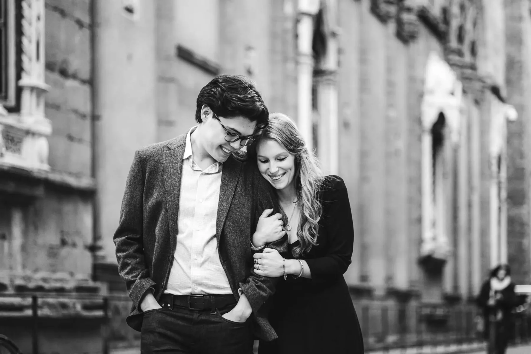 Elegant and romantic candid couple portrait during a walk tour in the streets of Florence the Cradle of Renaissance