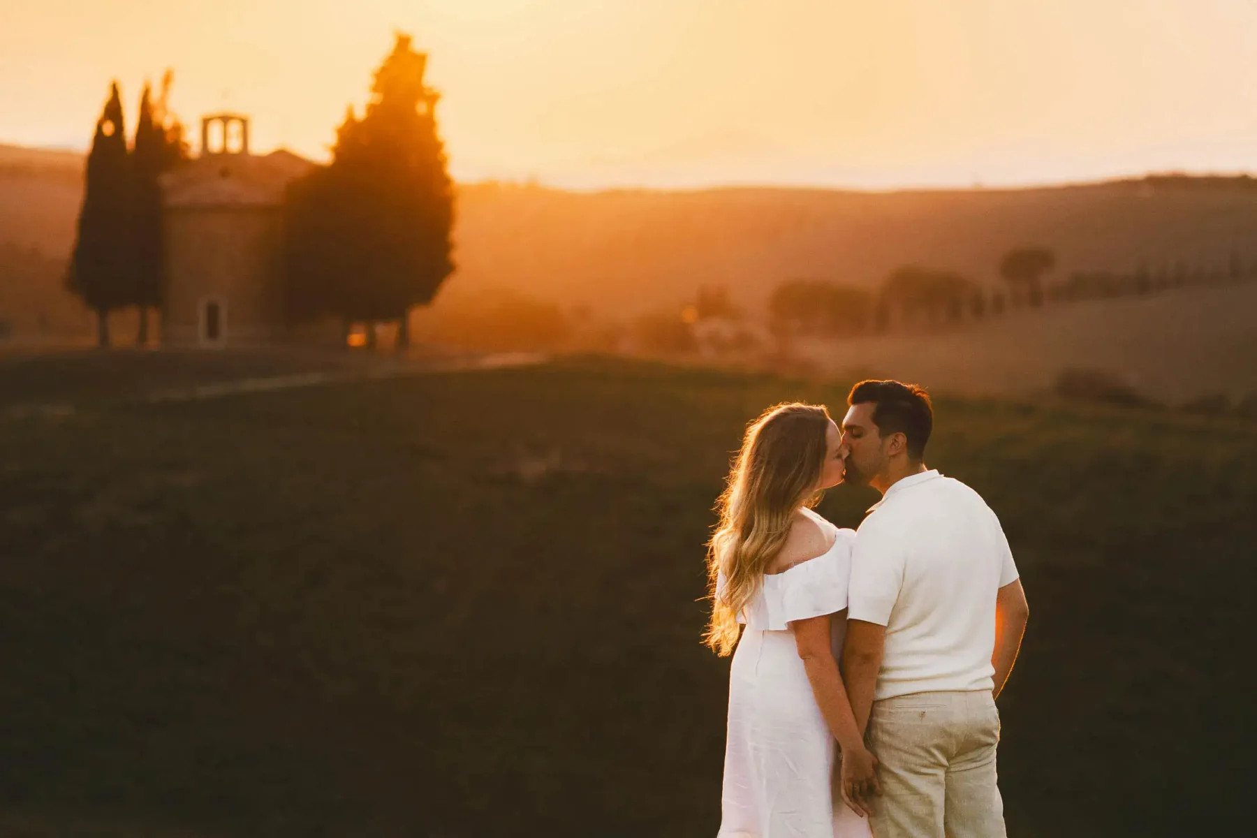 Unforgettable and breathtaking engagement photo shoot at Vitaleta Chapel in the heart of Tuscany countryside of Val d'Orcia near Pienza