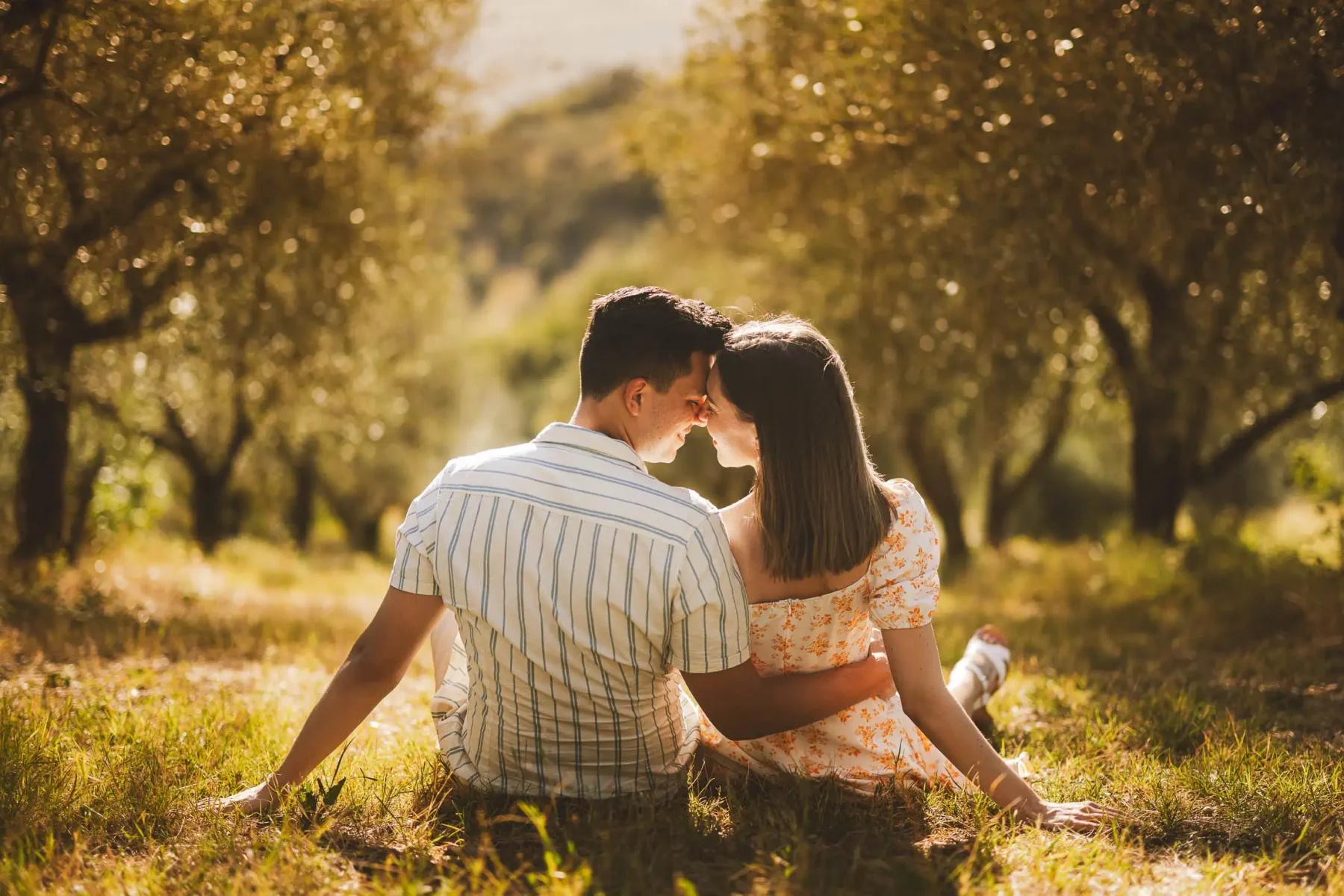Romantic couple photo shoot in Chianti Tuscany countryside olive groves during golden hour