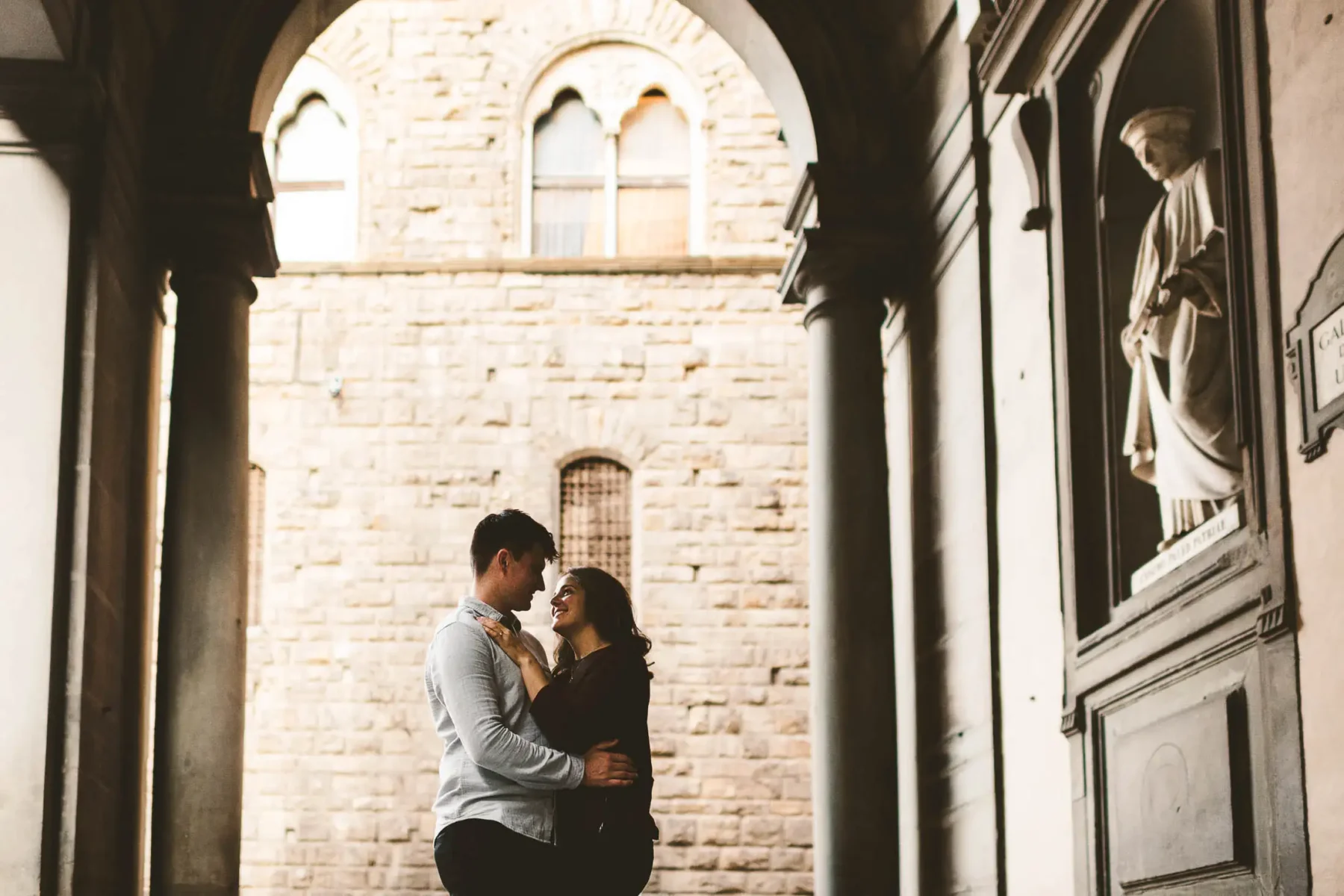 Exciting couple portrait session sunset Florence Uffizi area