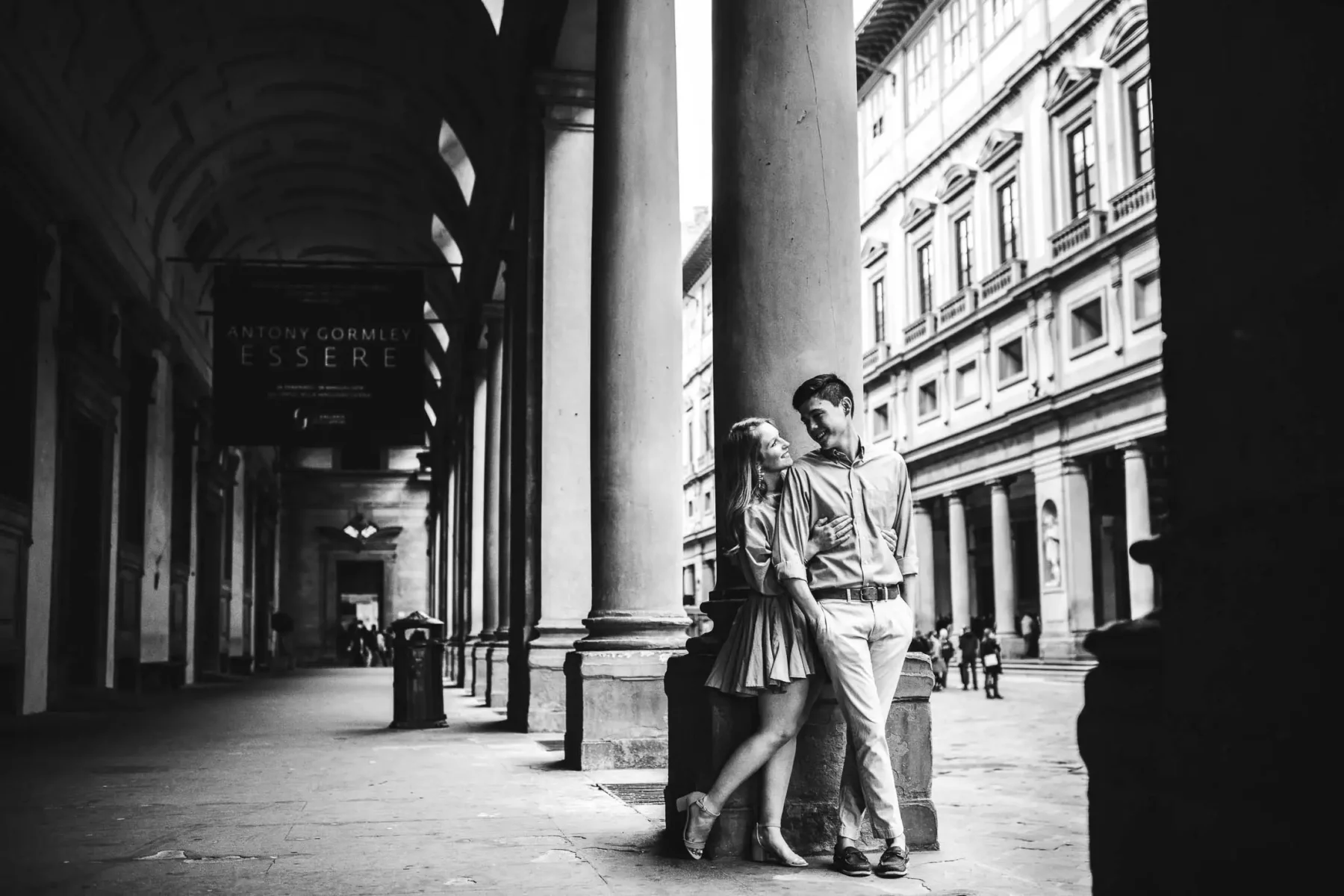 Romantic and elegant engagement couple portrait in Uffizi Gallery Museum in Florence during sunrise
