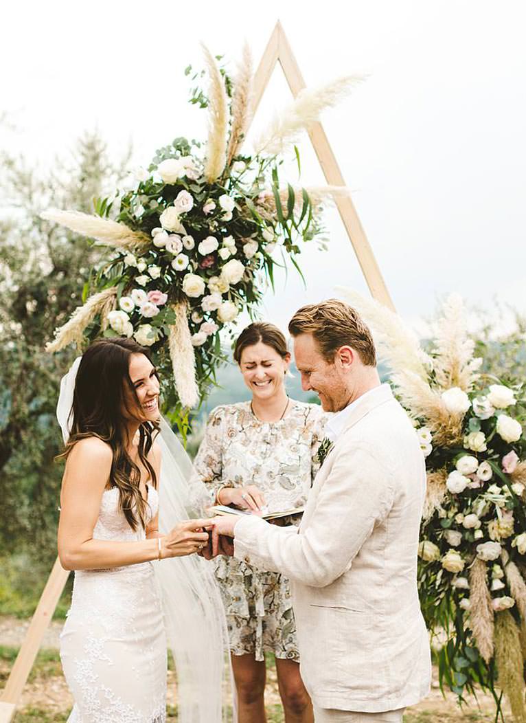 Modern and unusual wedding framed by the olive groves of Chianti. Intimate romantic and elegant destination wedding in Tuscany at historic residence of Villa Il Poggiale