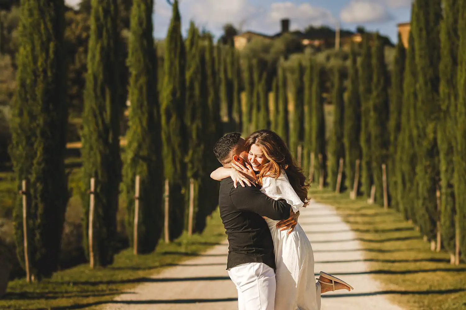 A surprise marriage proposal photoshoot among the cypress trees