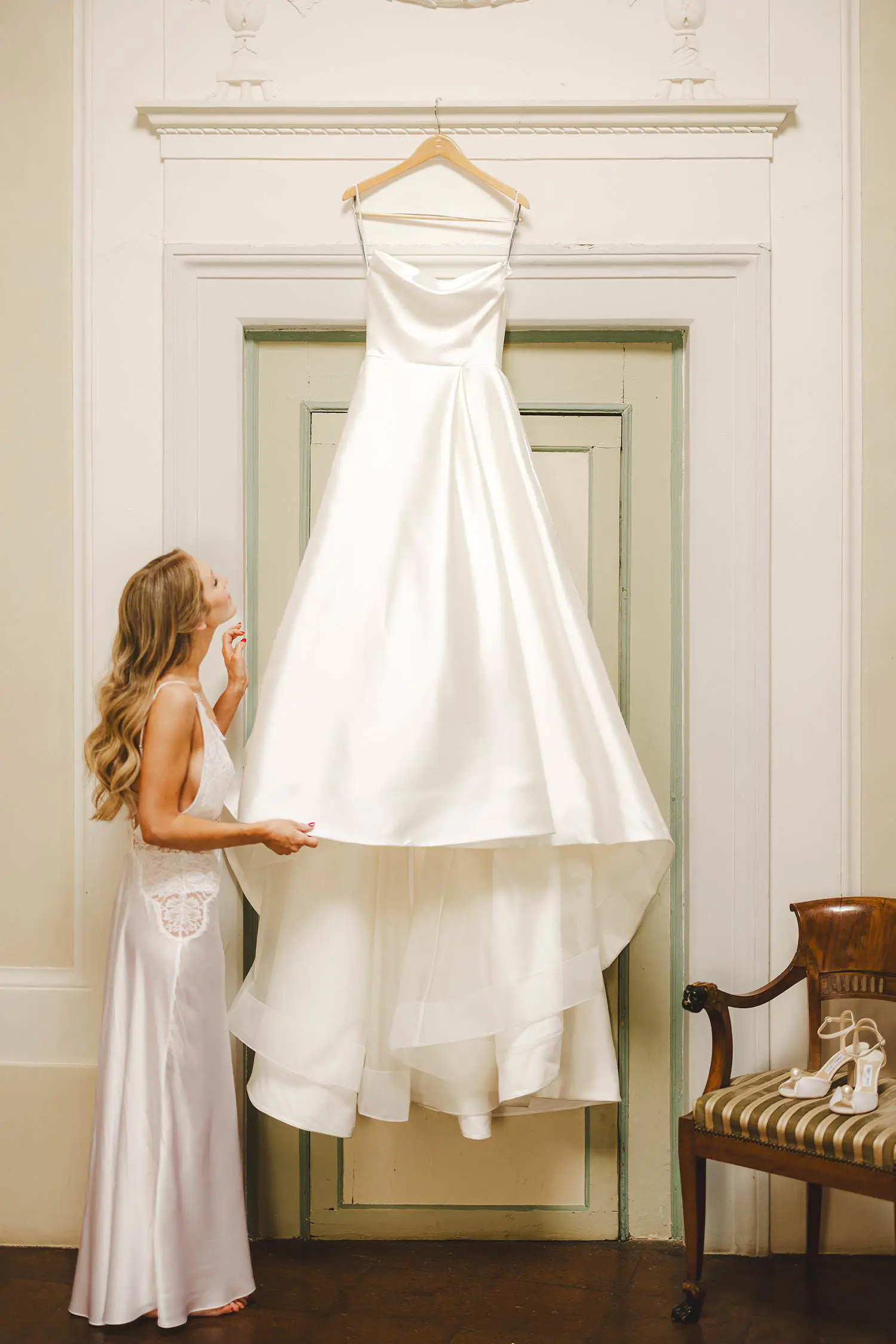 Elegant bride with wedding dress in a suite of luxury Castello di Celsa wedding in Tuscany