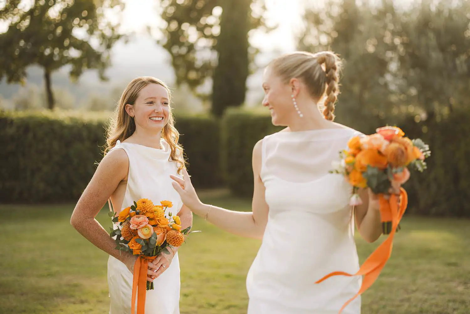 Candid and authentic brides couple portrait for a joyful same sex wedding at Borgo di Petrognano