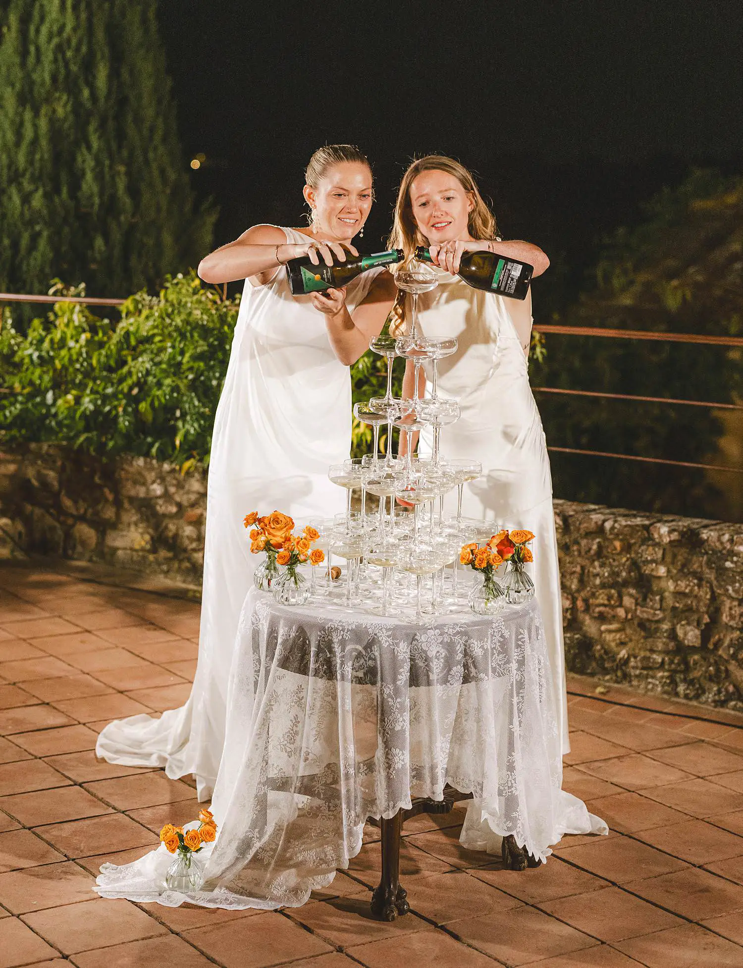 Lovely and exciting champagne tower celebration for a same sex destination wedding to remember in Tuscany at Borgo di Petrognano