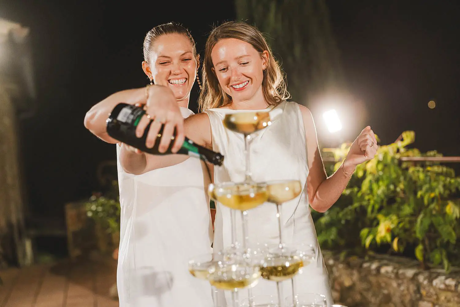 Lovely and exciting champagne tower celebration for a same sex destination wedding to remember in Tuscany at Borgo di Petrognano