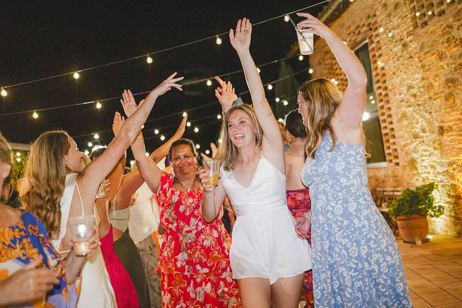 Exciting dancing under the Tuscan night at Borgo di Petrognano same sex wedding, surrounded by people who feel like home