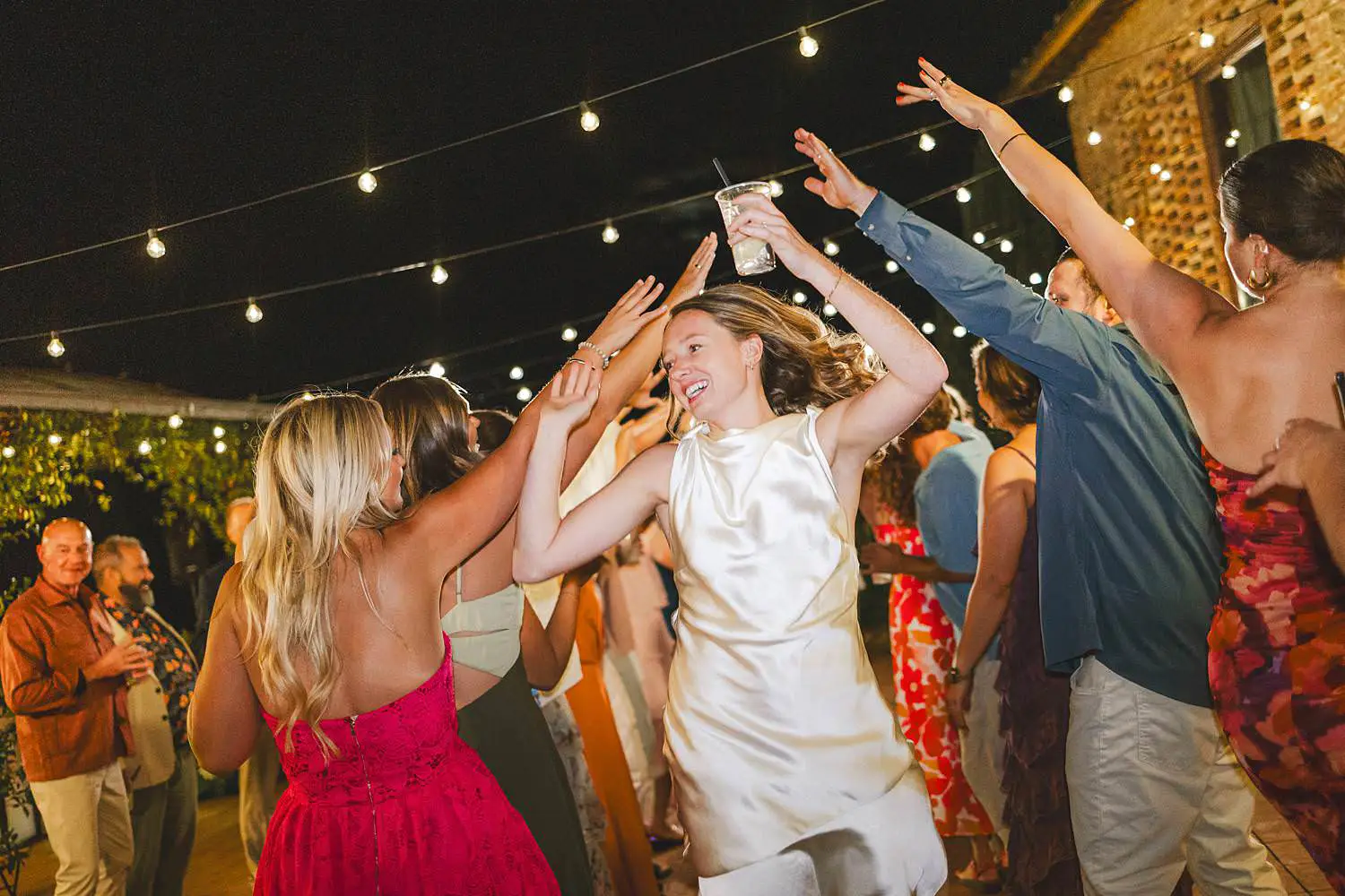 Exciting dancing under the Tuscan night at Borgo di Petrognano same sex wedding, surrounded by people who feel like home