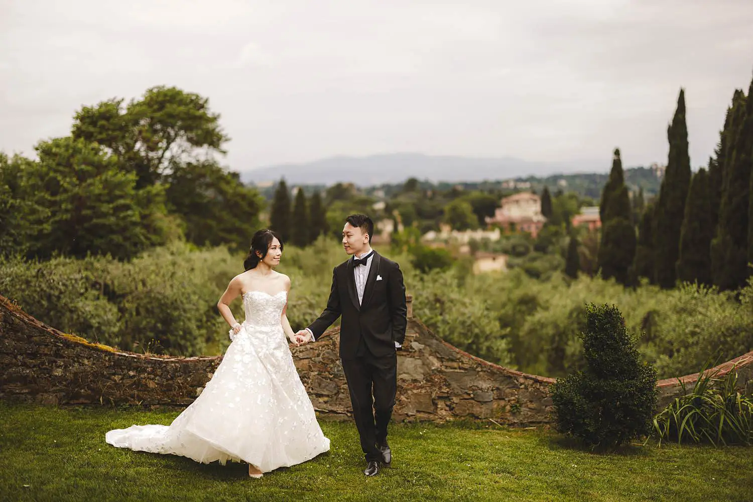 Classic and timeless bride and groom portrait at Villa Agape Italian garden overlooking the countryside
