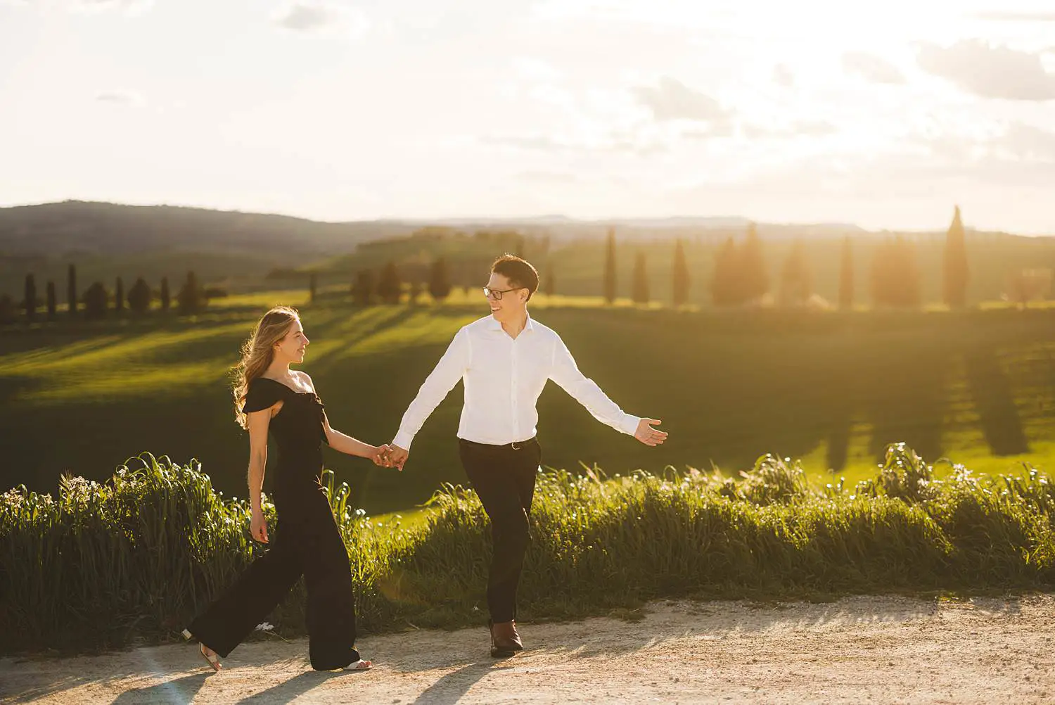Golden hour candid portraits under warm light of Pienza in the most iconic landscapes in Tuscany
