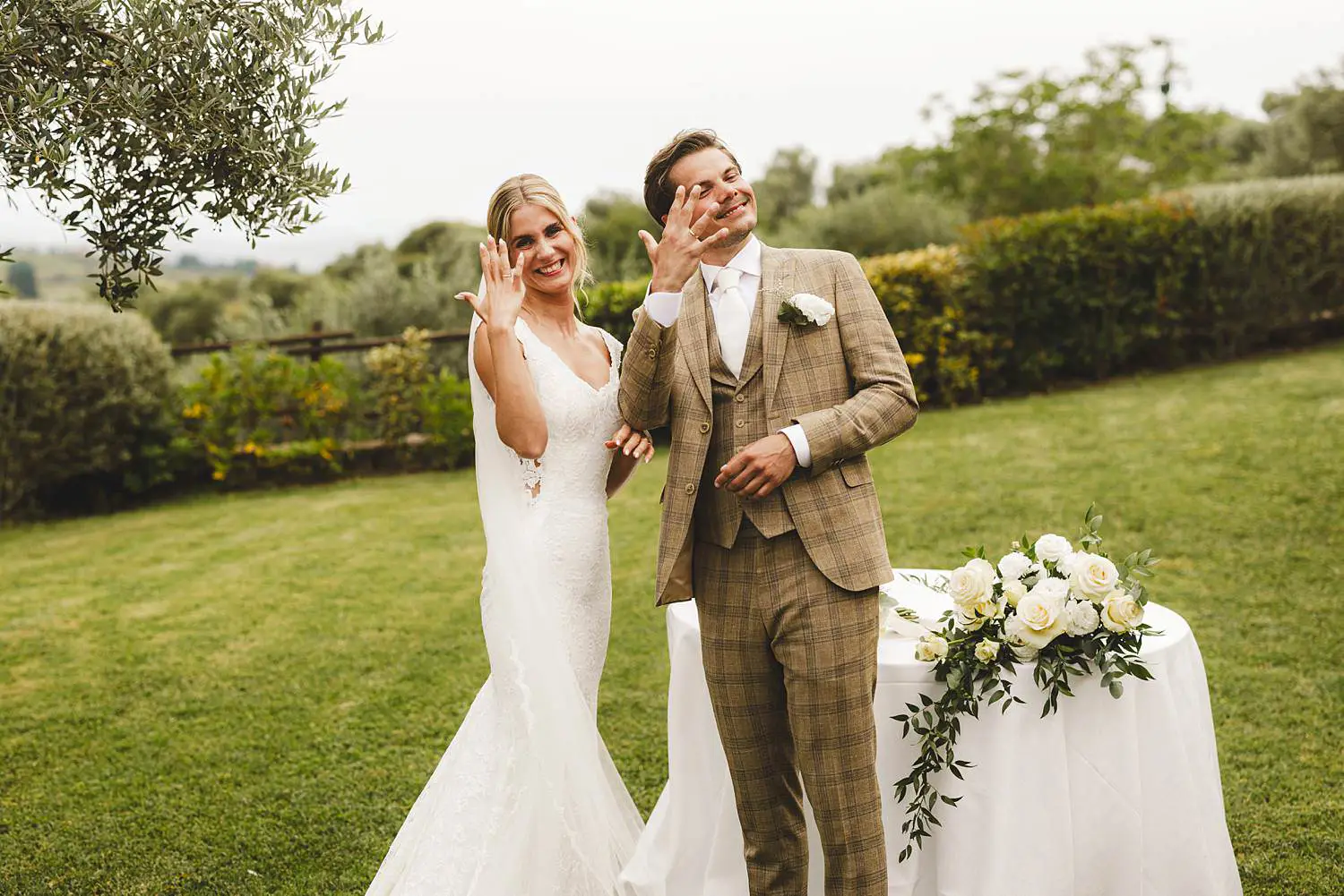 Nice and lovely moment at the end of outdoor intimate wedding ceremony at Quercia al Poggio, bride and groom are just married