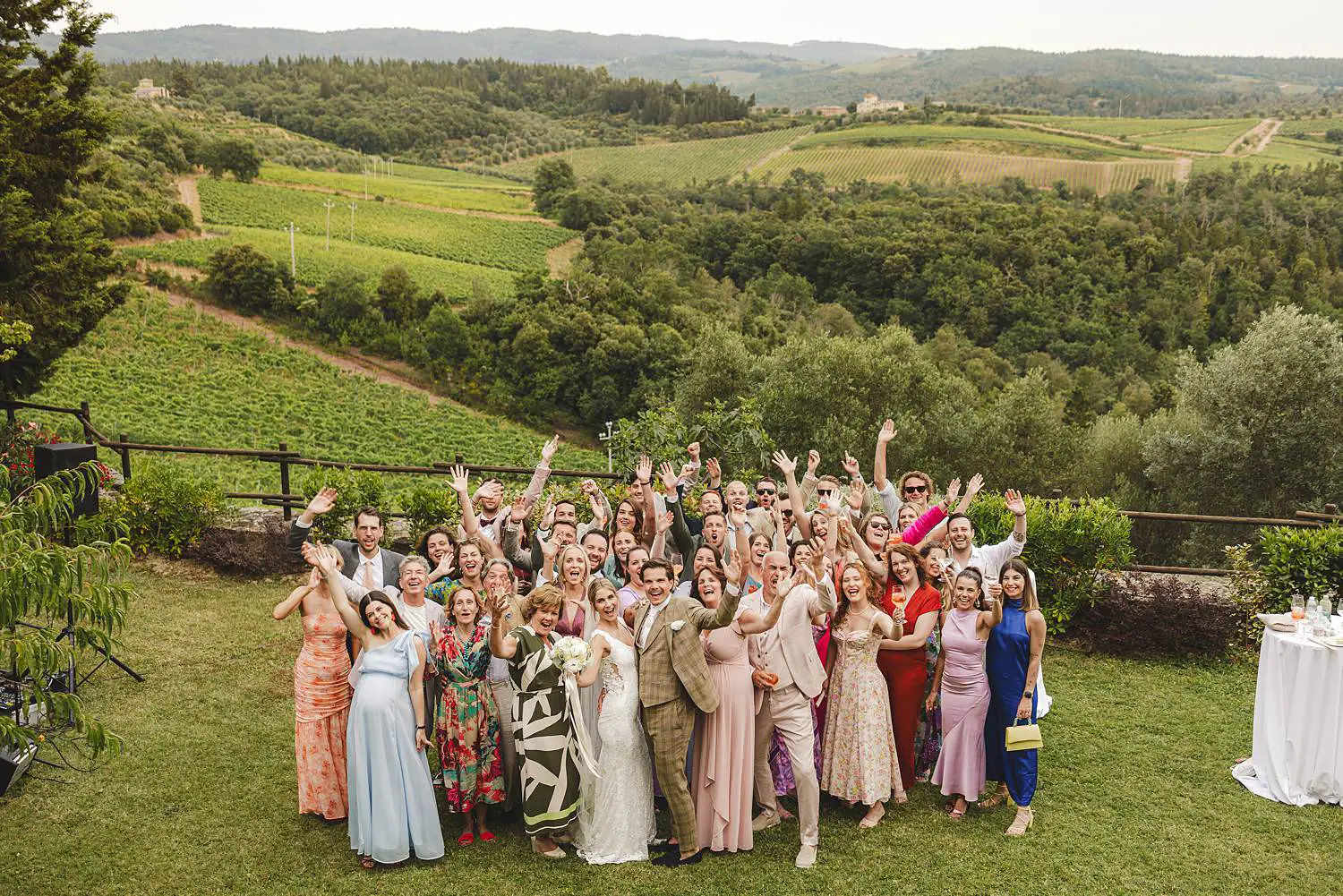 Bride and groom surrounded by friends, family and the natural beauty of the Chianti landscape at Quercia al Poggio