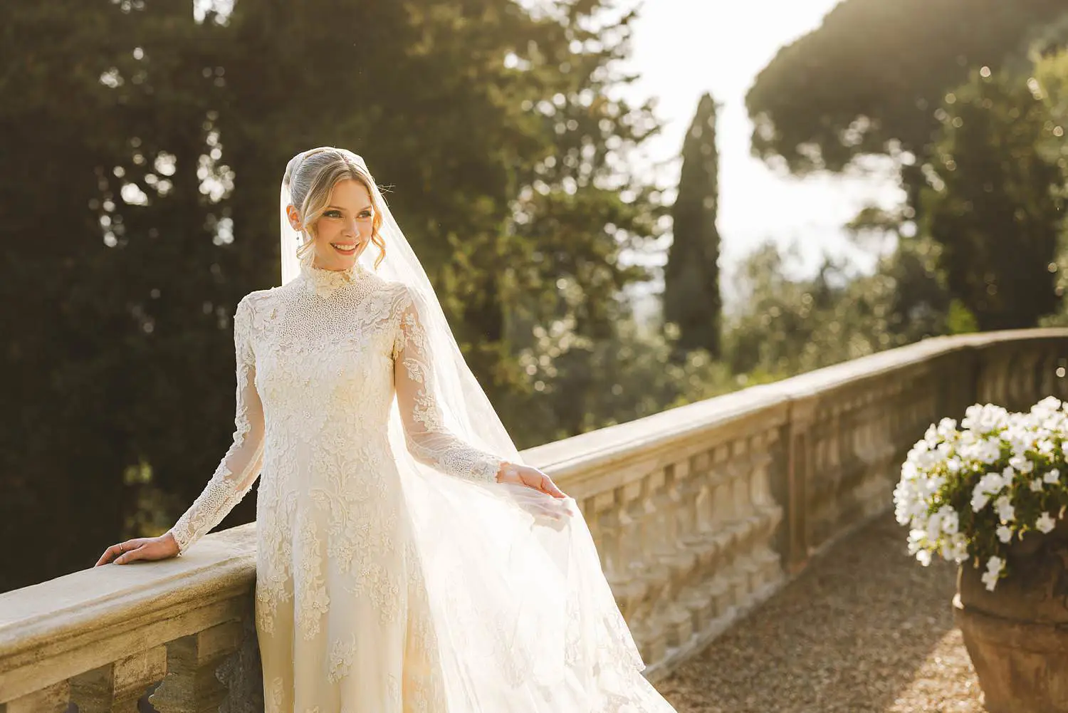 Elegant bride under warm golden hour Tuscan light at Villa Belvedere in Loro Ciuffenna