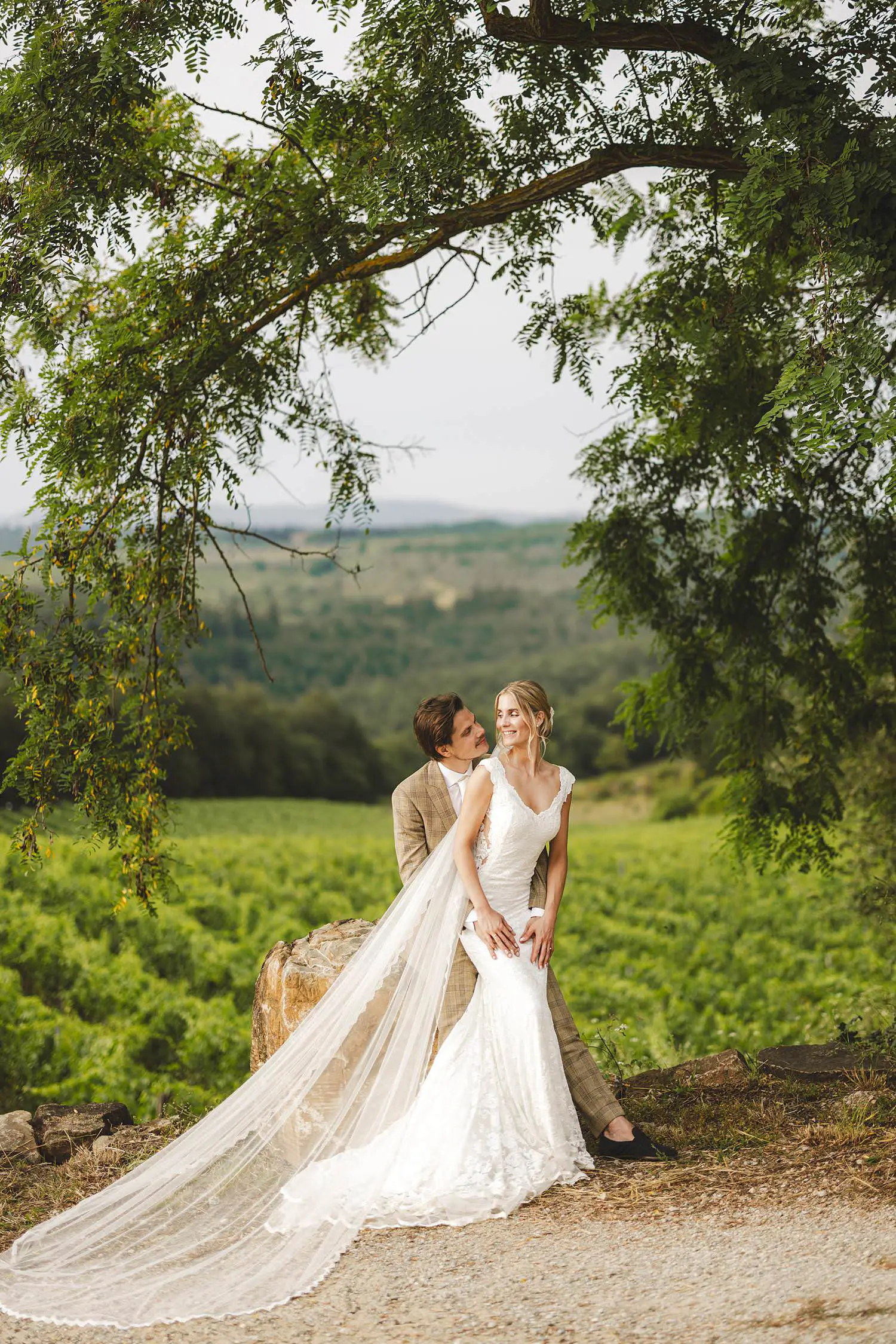 A timeless bride groom portrait overlooking Chianti vineyard at Agriturismo Quercia al Poggio